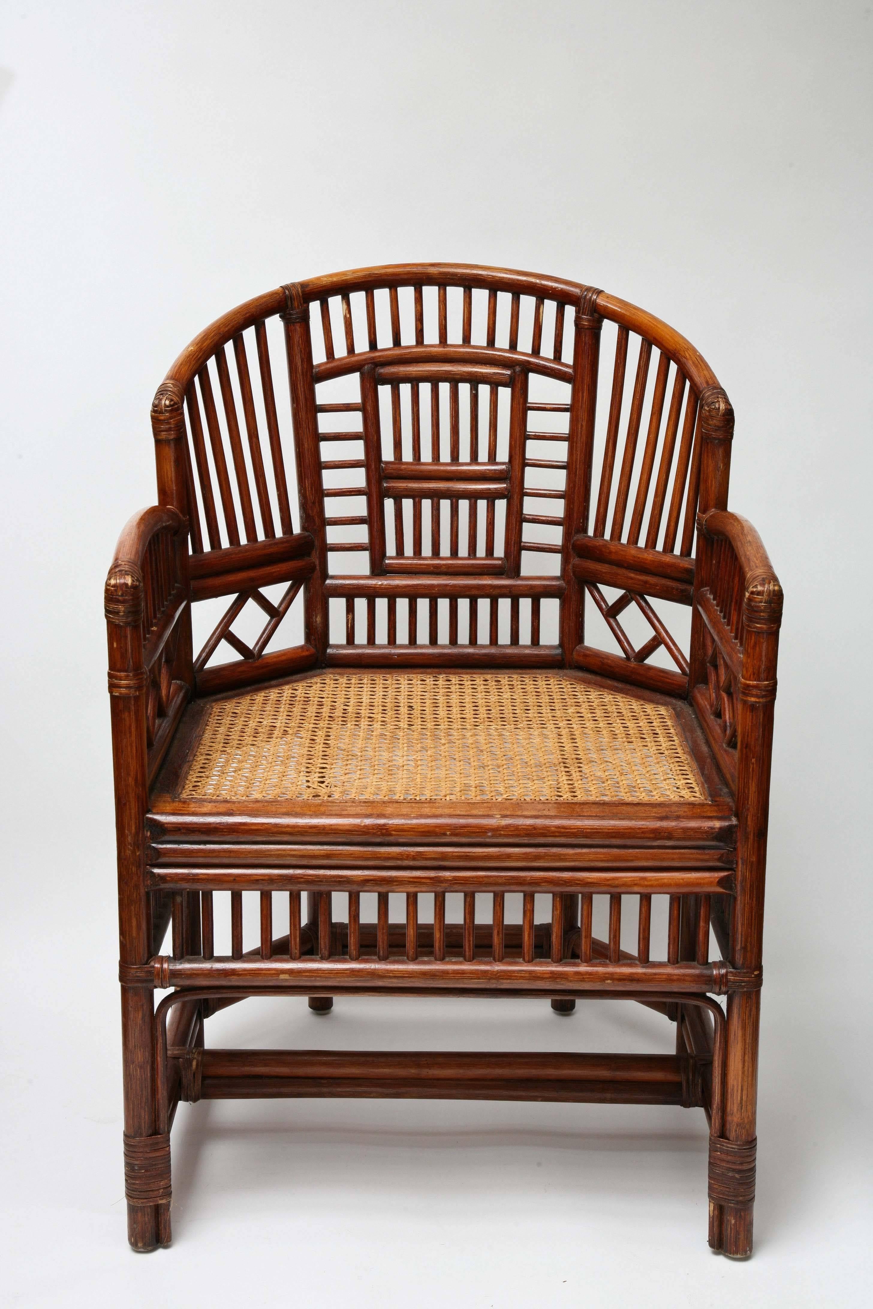 A pair of English Chippendale style chairs with caned seat.