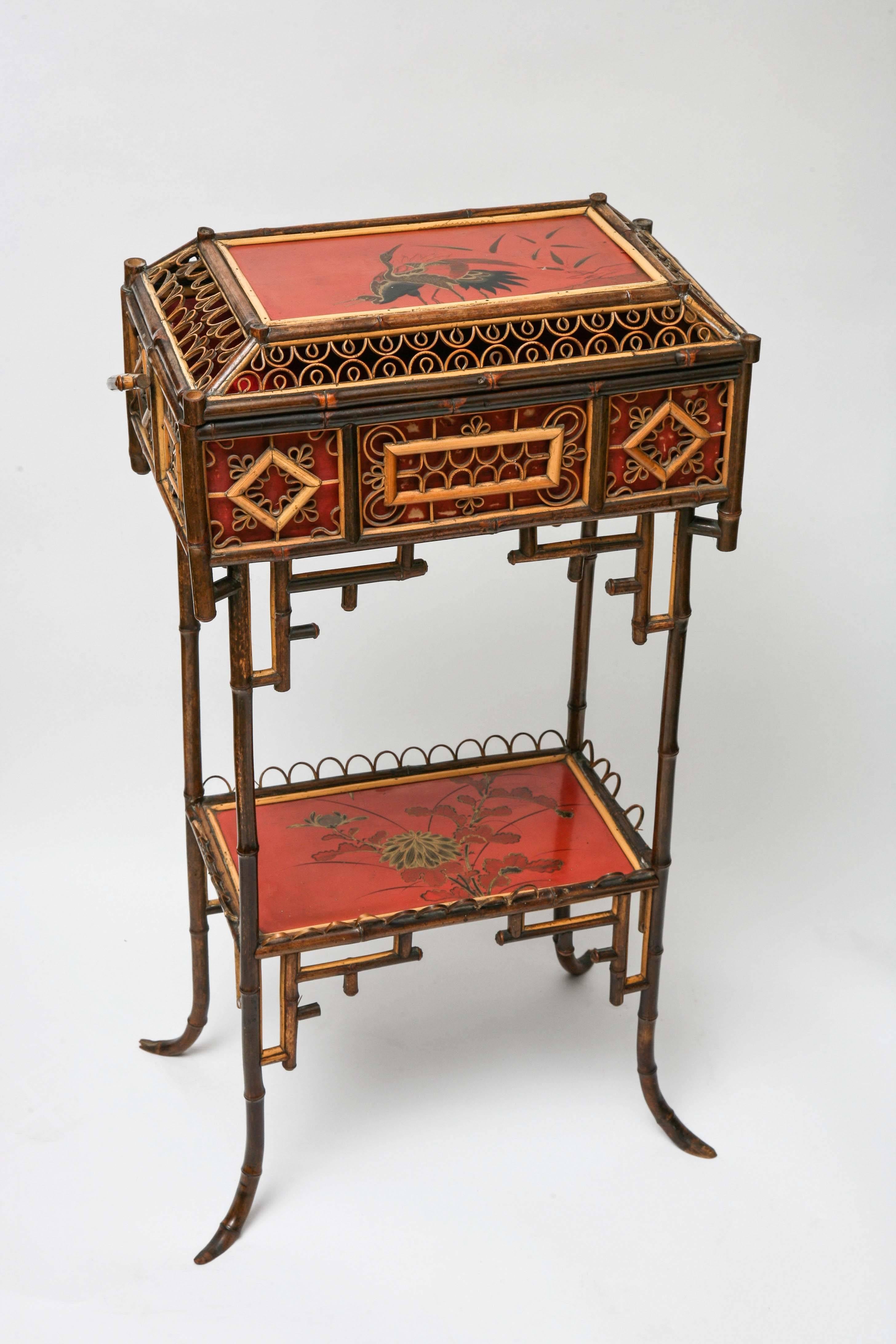 Fine 19th century English bamboo sewing stand with two fine lacquered panels and very dedicated detail to form. Unusual piece and all original.