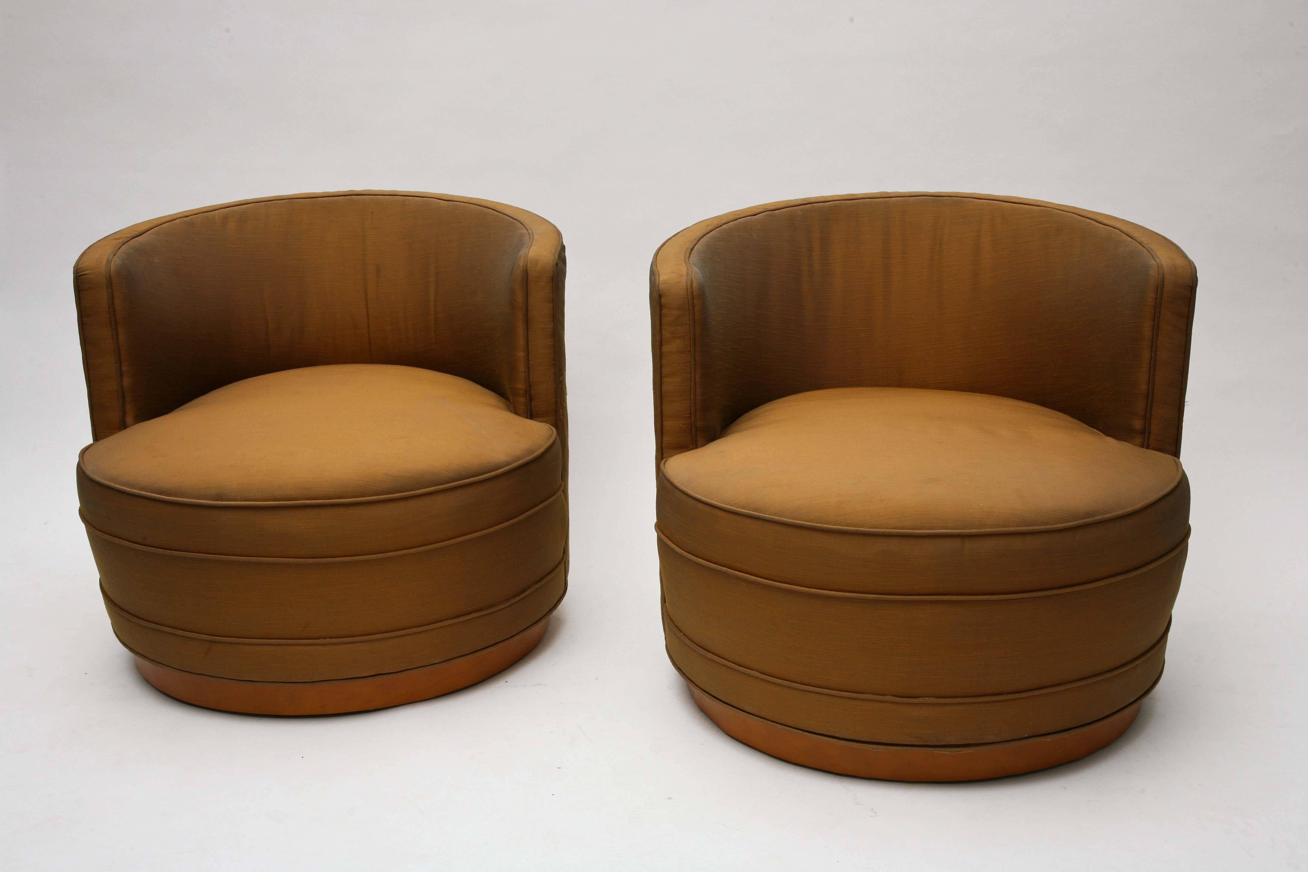 Pair of swivel lounge chairs designed by Edward Wormley for Dunbar
We have chosen to leave these in their original silk upholstery.
 