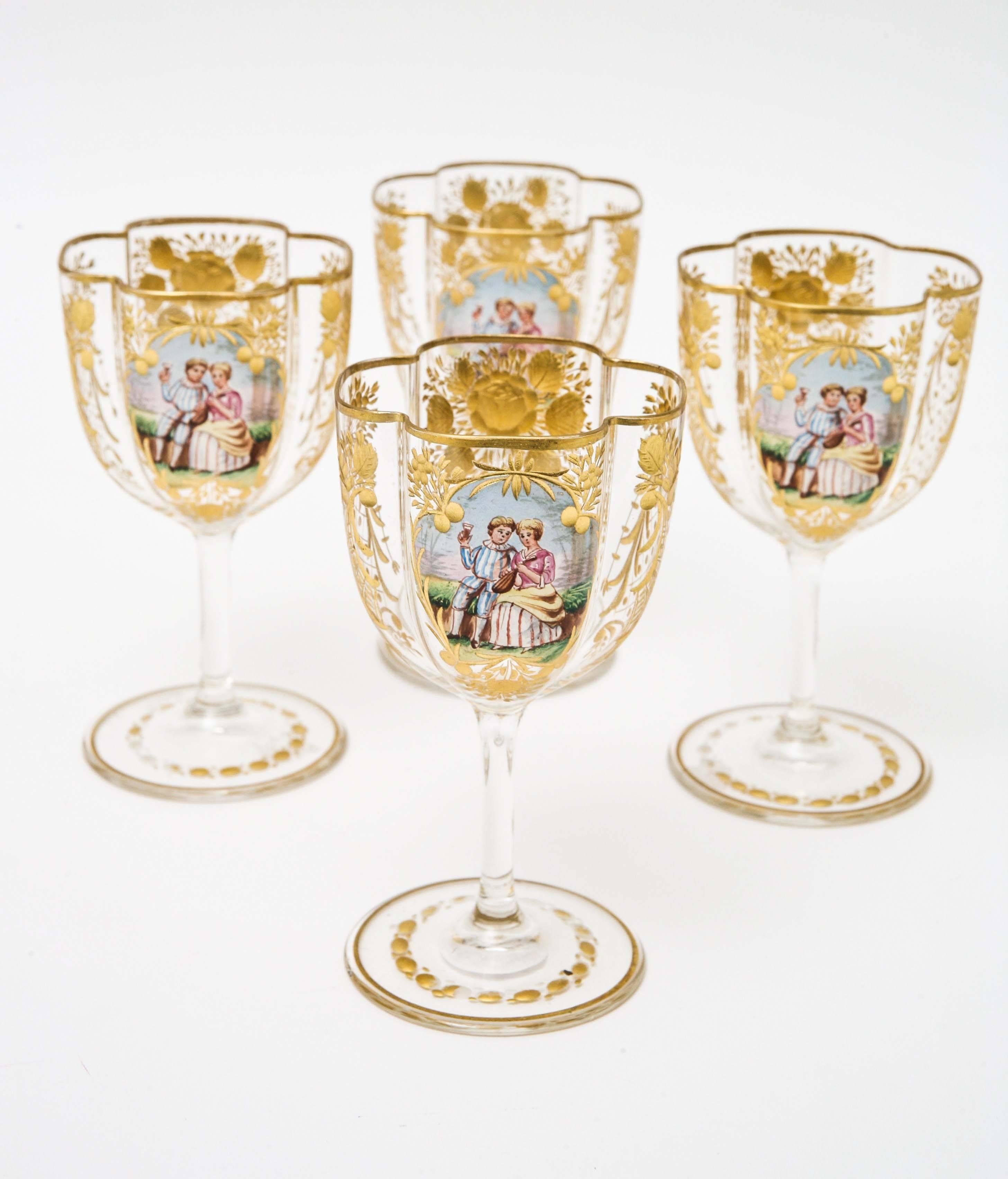 A delightful and elegant set of four sherry or petite wine glasses that match the six champagne coupes we just put on. Beautiful hand-cut and gilded foliate decoration and a cartouche of a romantic seen adds to the charm of these. In wonderful