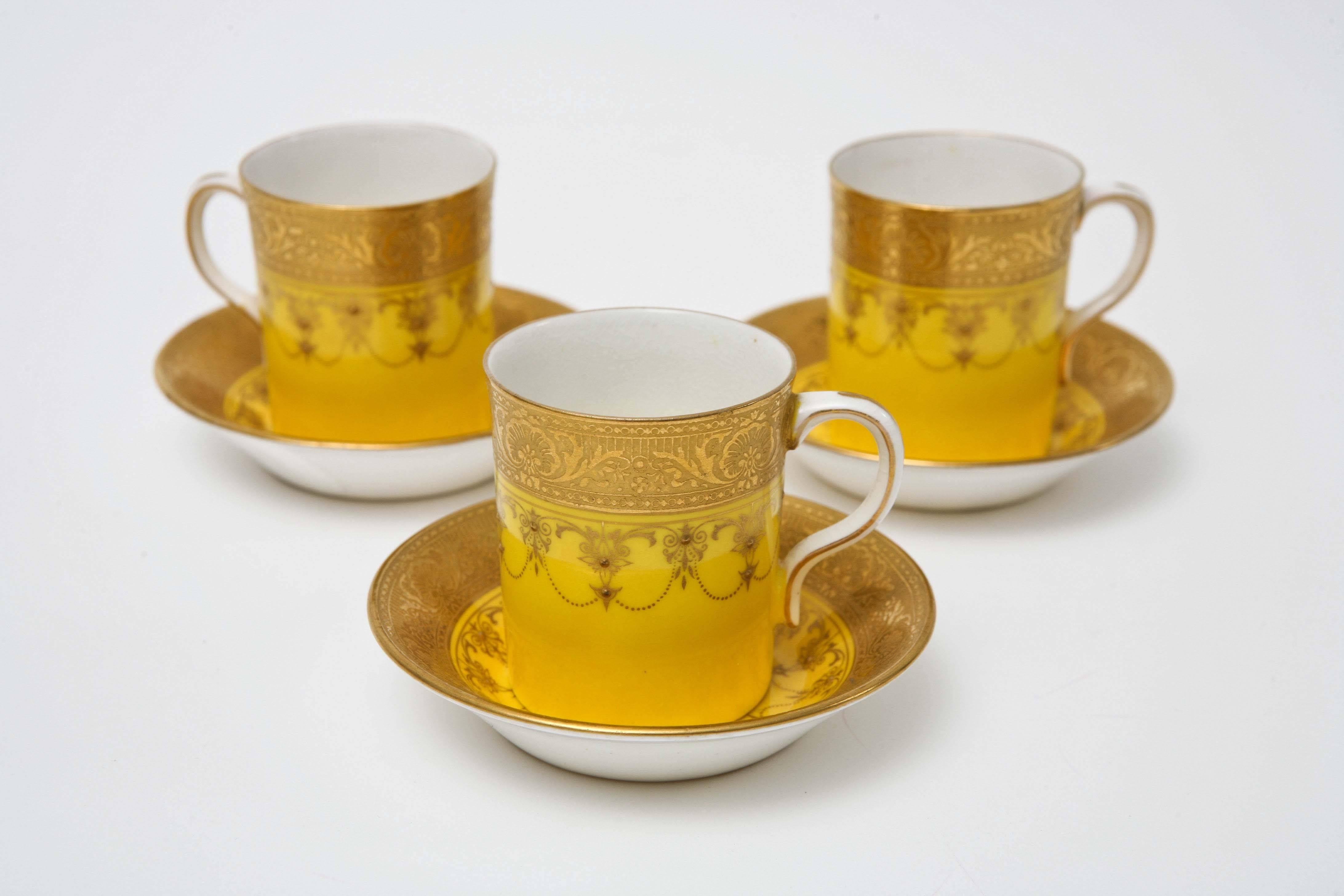 A set of 4 rare and hard to find yellow sweet little after dinner demi tasse coffee sets. These feature a beautiful raised gold swag motif and acid etched gold bands. Custom ordered though the fine retailer of Mappin and Webb London. Please note