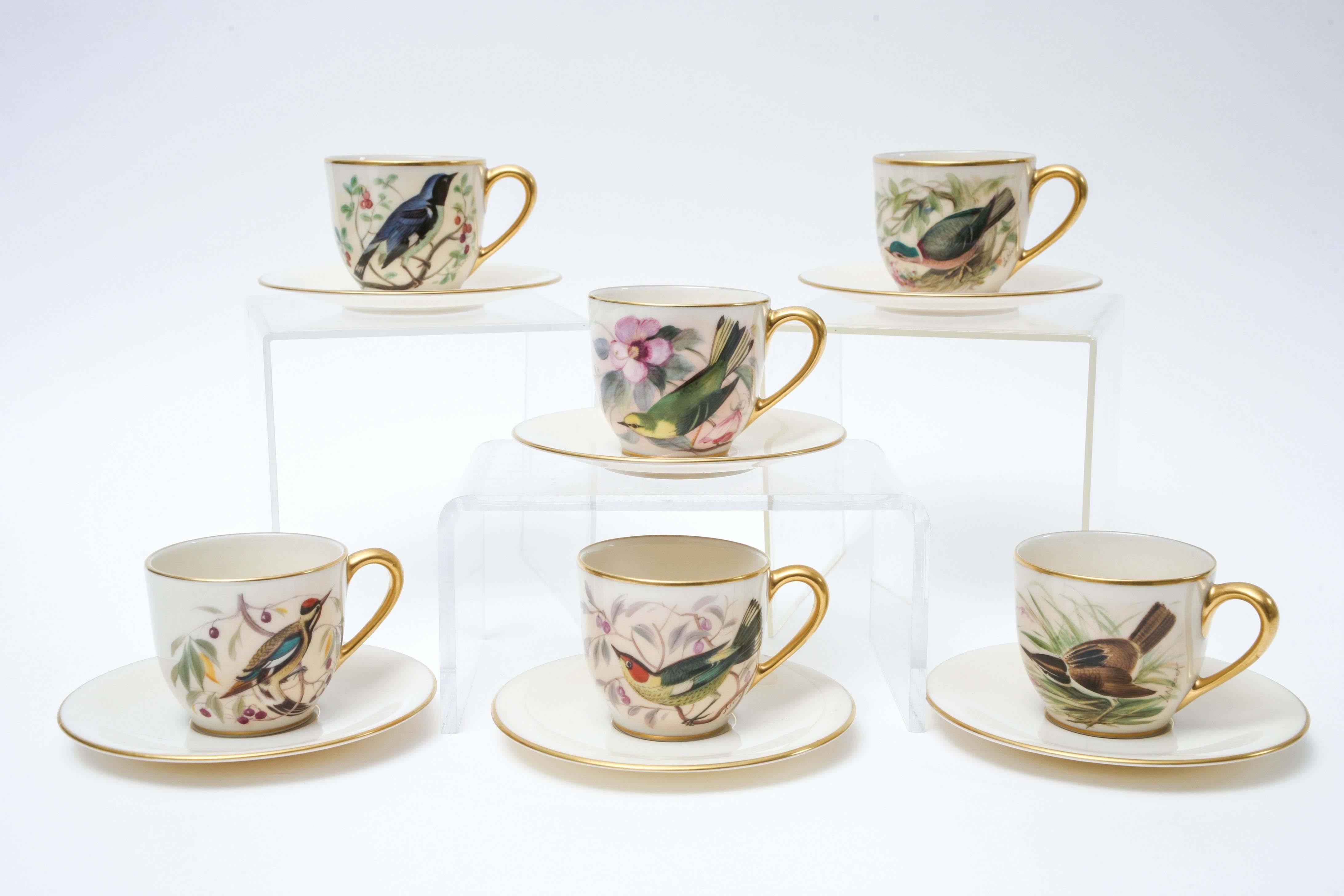 A set of six unique and whimsical demi tasse or after dinner coffee cup and saucers featuring a series of different birds hand-painted by Lenox's re known artist: Jan Nosek. These pieces are highly collectible and desirable due to the fact they are