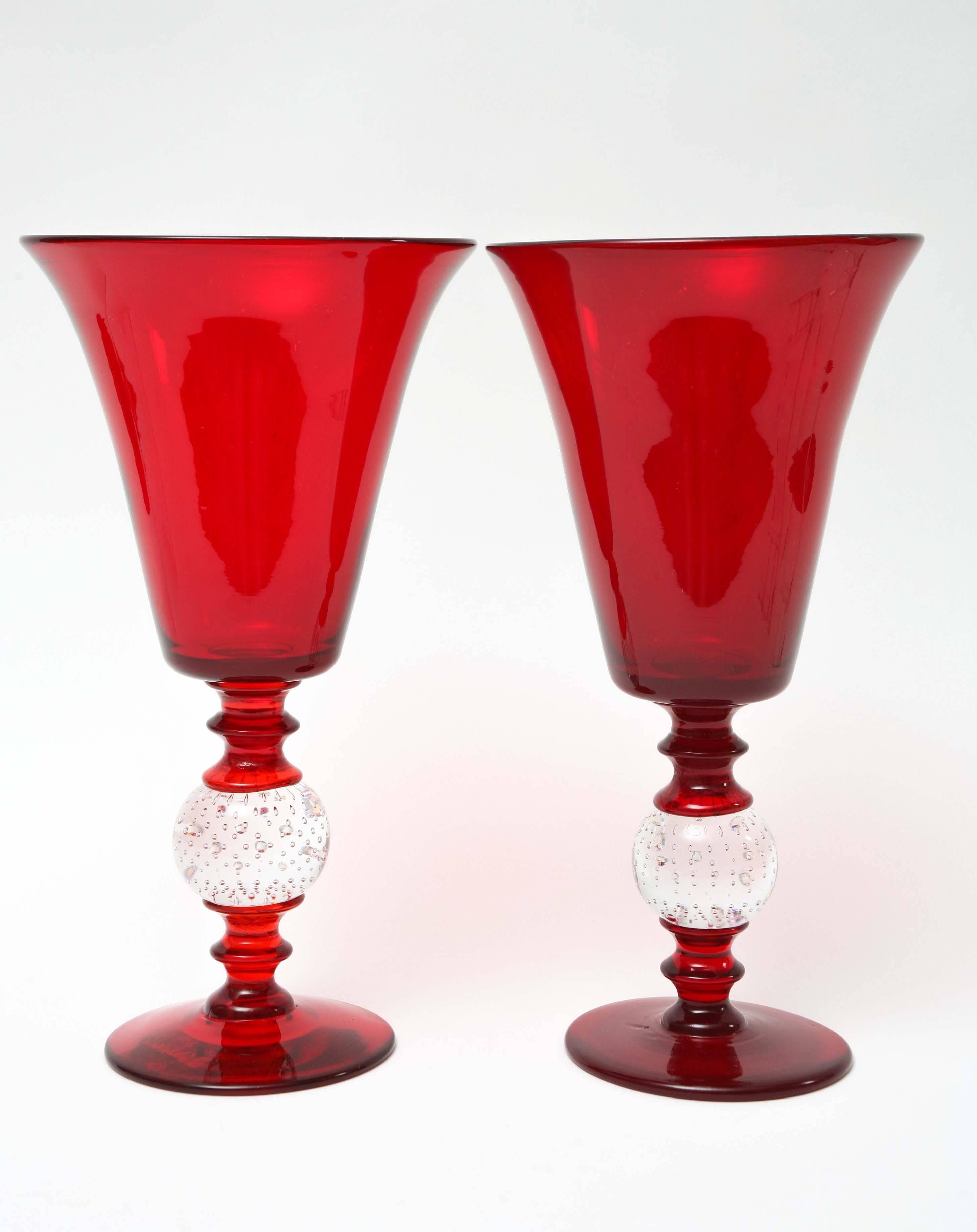 From one of our favorite glass blowers, New Bedford MA is this near matched pair of blown vases in the Classic inverted bell shape. As these pieces are individually blown, you can see the slight differences in the stem size and color. So wonderful