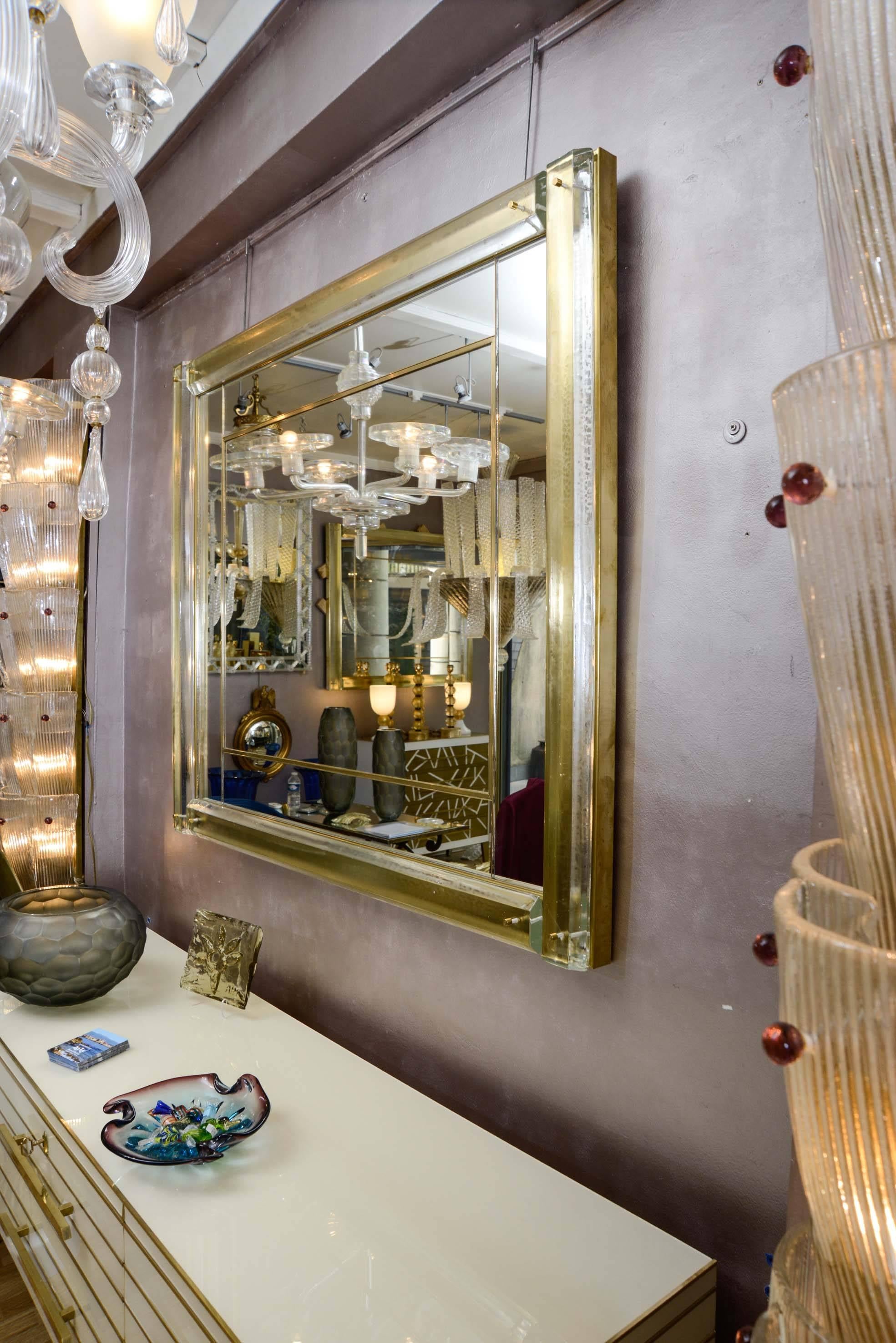 Brass Mirror surrounded with Murano glass.