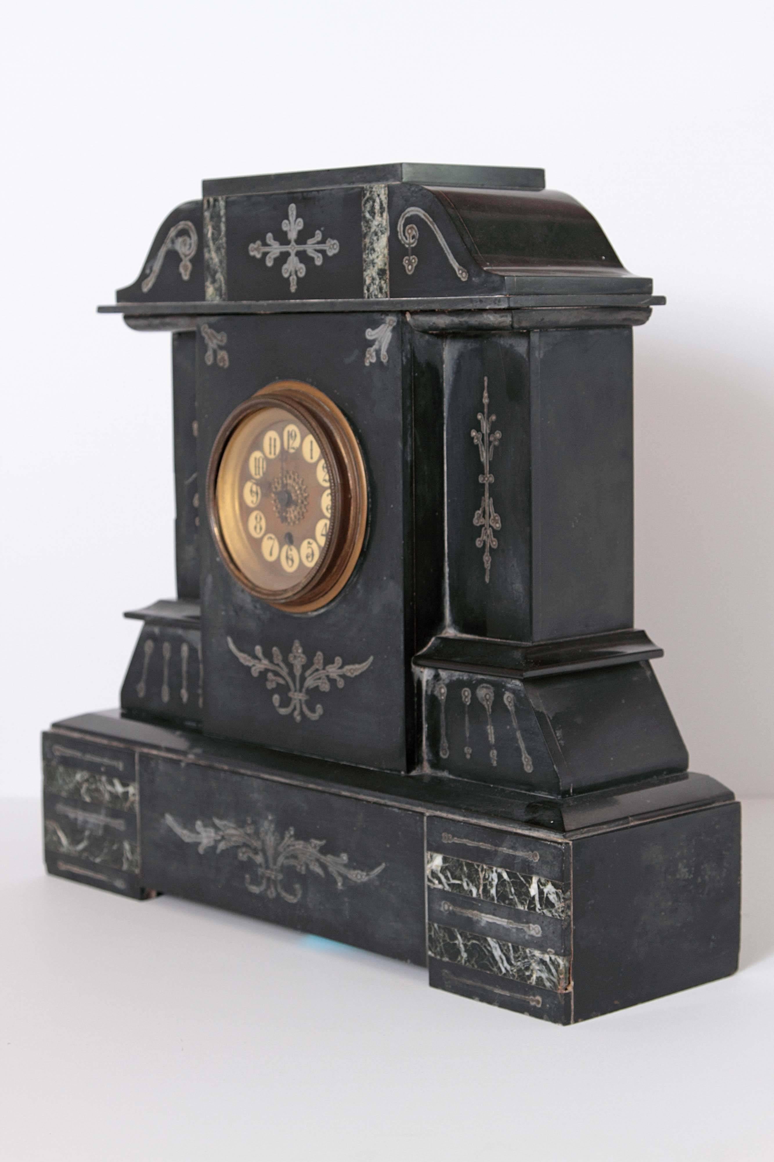 Beautiful Victorian French marble mantel clock circa 1880 with jet black nero belgio marble. This piece is in fabulous condition and includes hand-painted detailing around the face of the clock. 

Minor wear on the lower part of the marble base.