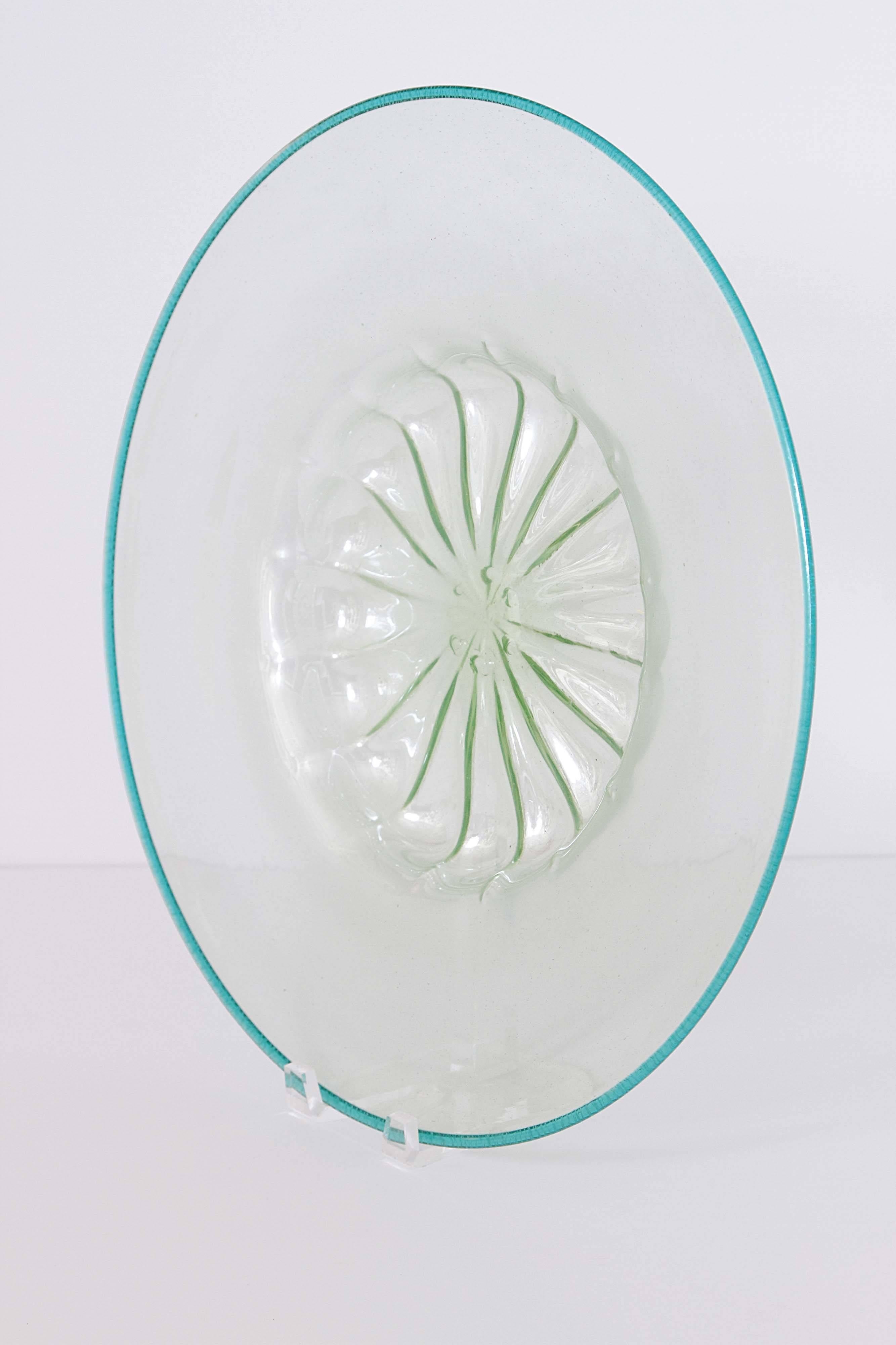 Large Venetian glass plate with intricate center detailing, clear green color.