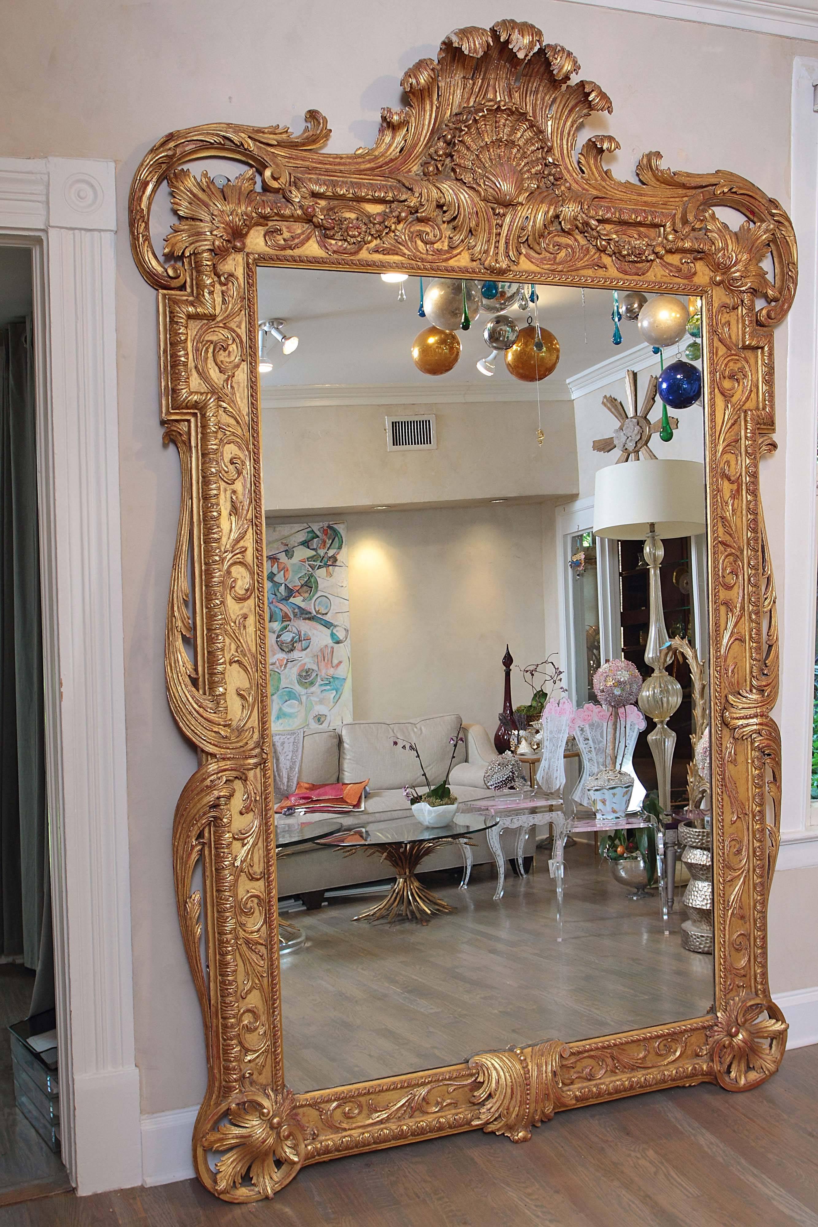 Extra large full length gold Rococo style dress mirror. 

Magnificent in size, this gold Rococo mirror has an ornate carved frame. This superb quality large gold mirror has a sturdy Stand so the angle of the glass can be adjusted. A full length