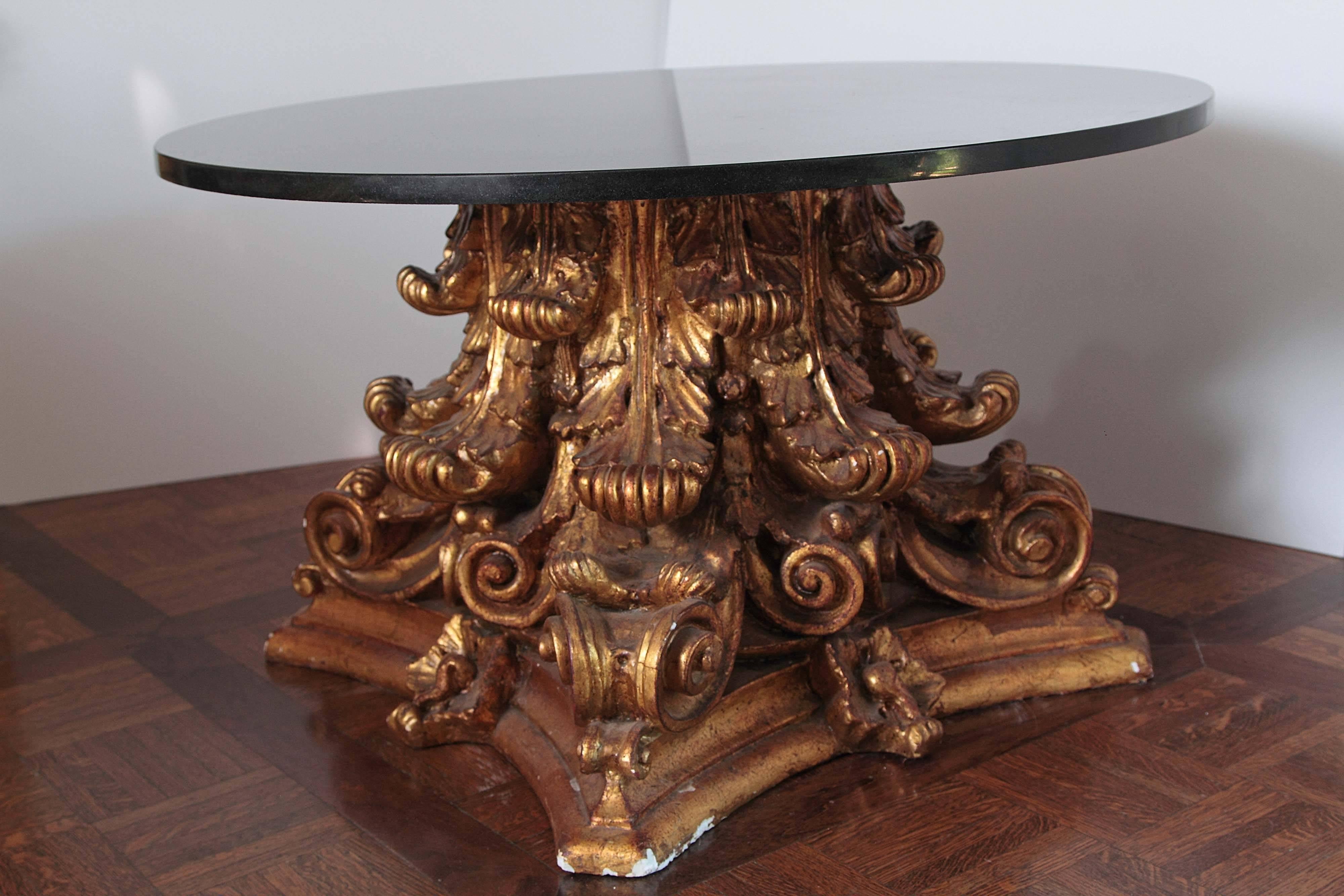 Roman Architecture Capital has been beautifully decorated with Acanthus Leaves and Scrolls. Adornments are on all side 360 degrees. The top is a solid black marble round top that sits atop the base. 

Measures: 35