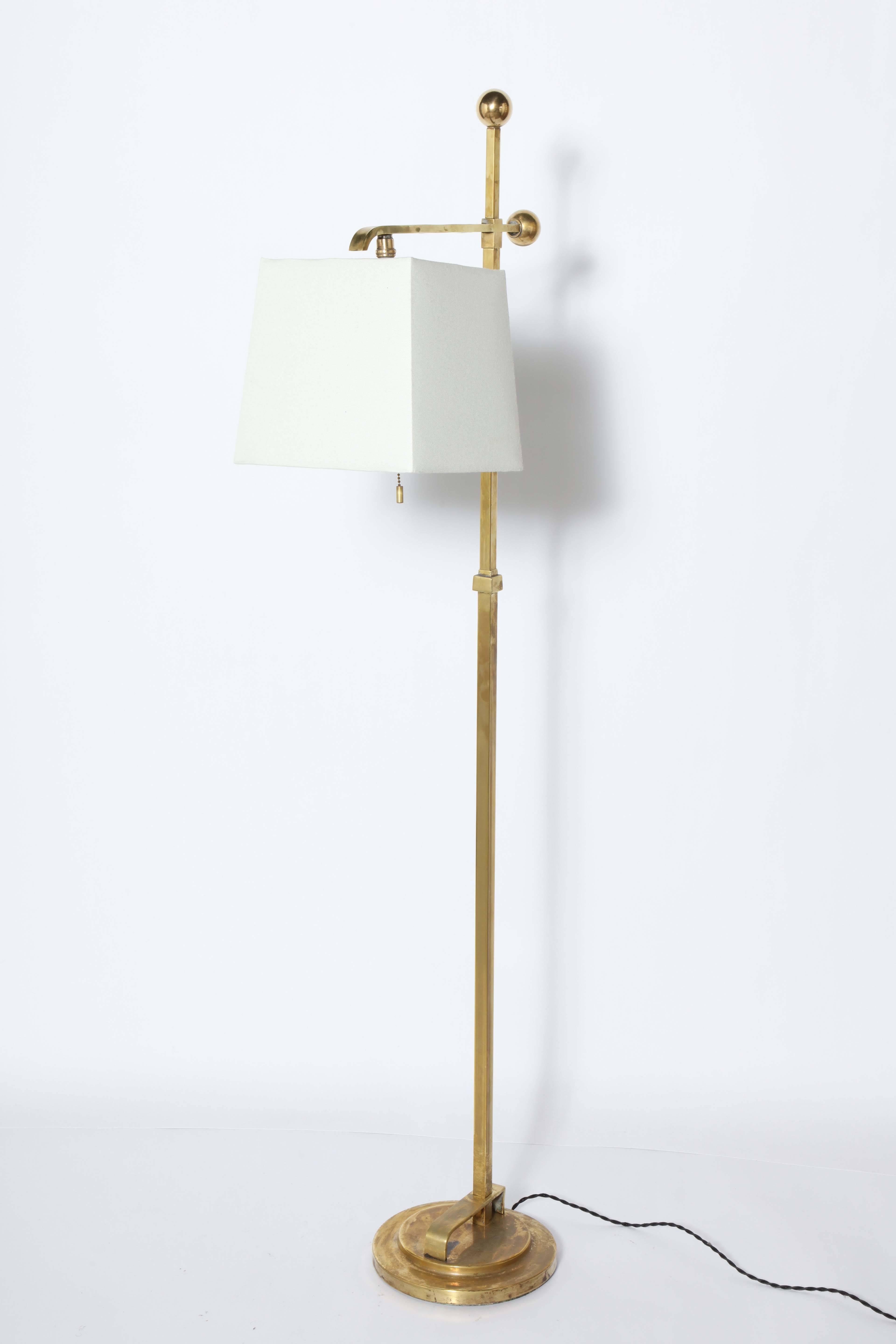 Art Deco Donald Deskey Brass Reading Floor Lamp by Deskey-Vollmer Inc.  With new Off-White Linen Shade (9H x 8W x 9.5W) on round base. Ball Socket. Vintage distressed finish. Rarity. Made in New York. 