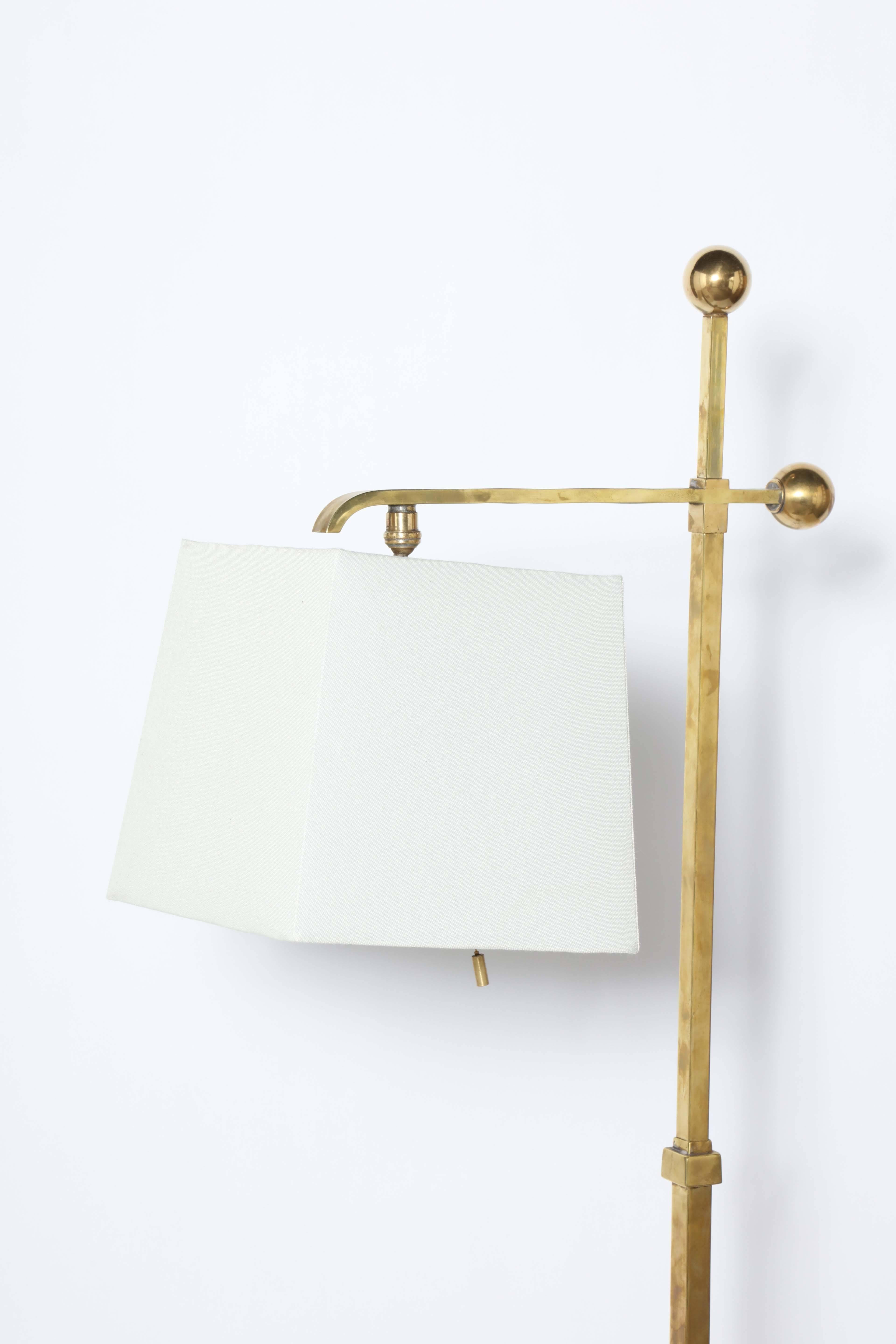 white and brass floor lamp