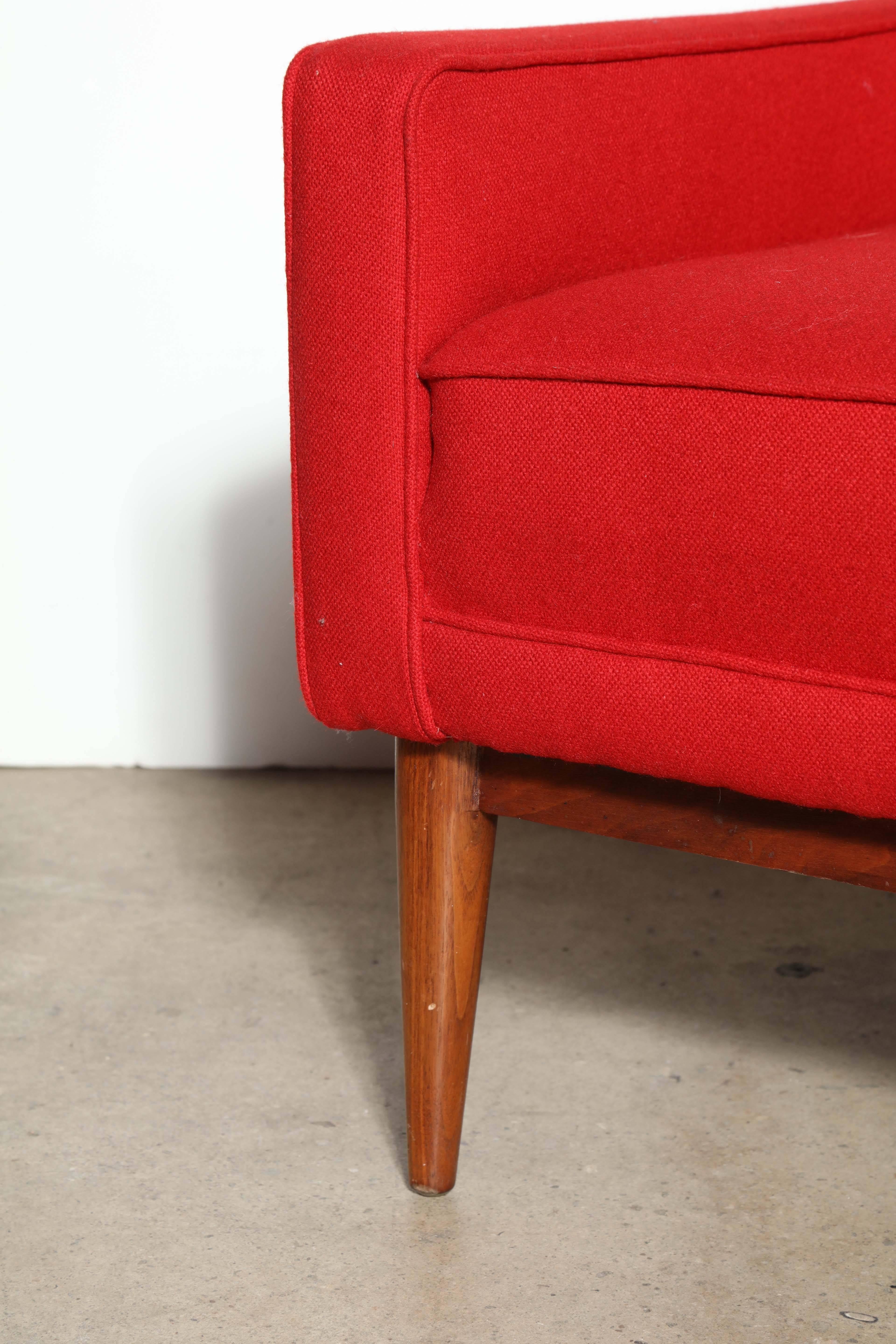 1956 designed sculptural and ergonomic Paul McCobb for Directional model 1312 high back club chair with walnut frame and red wool upholstery. Arm height 21