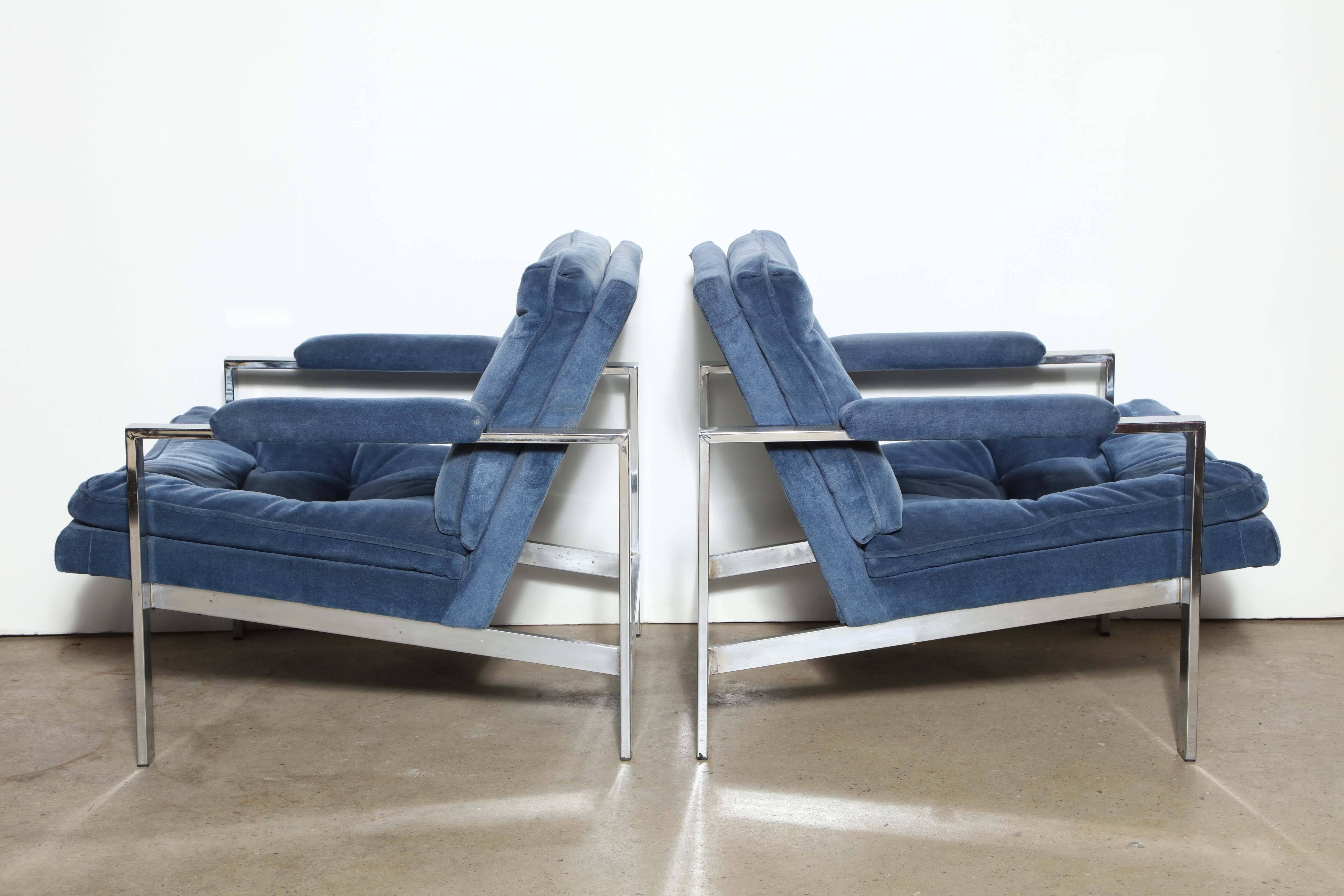 Circa 1970 Modern Pair of Cy Mann Chrome and Fabric Armchairs.  Featuring wide, slant back design with solid Chrome construction and tufted French Blue Velvet upholstery.  Comfortable.  Milo Baughman style.  Supreme Italian production quality. 
