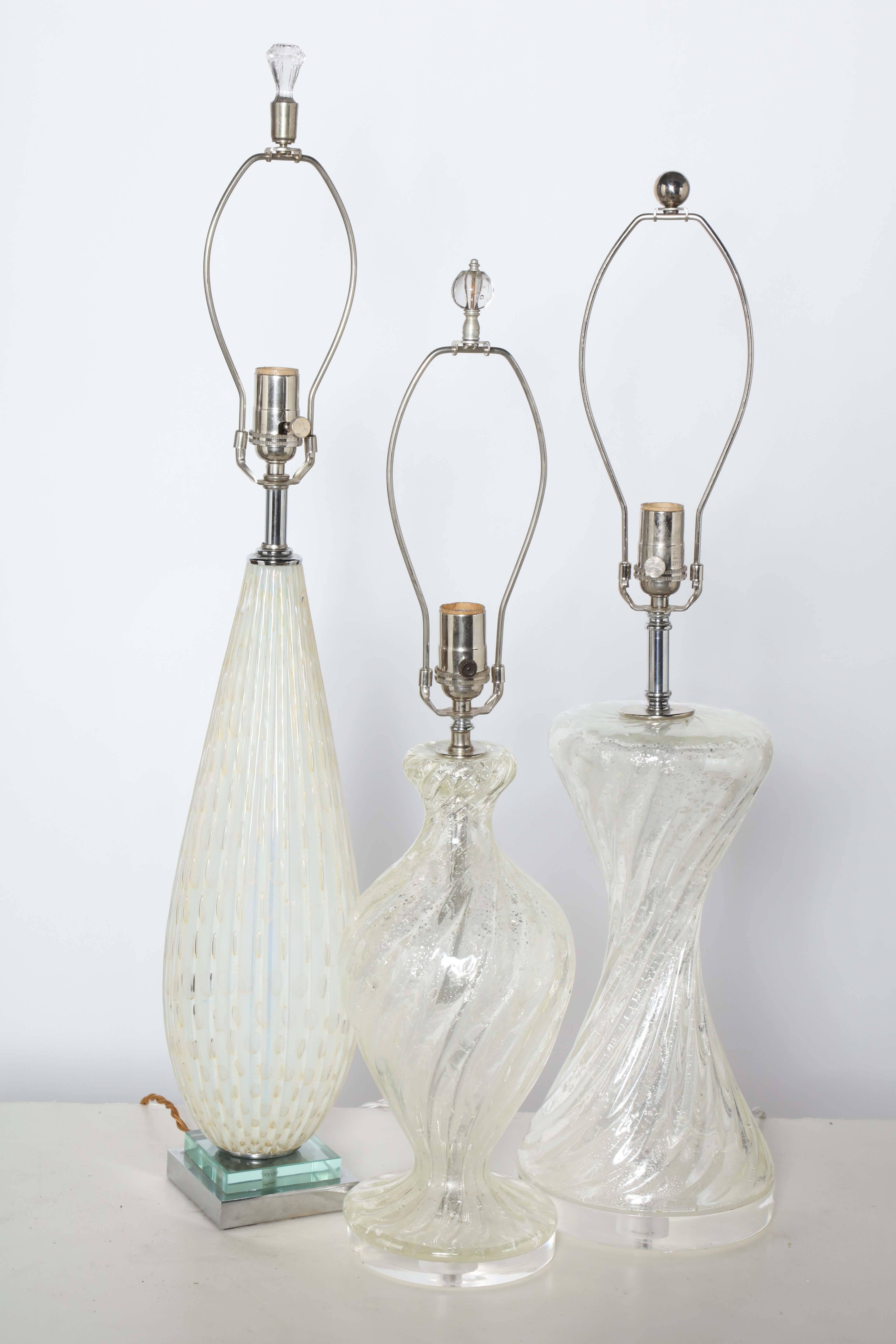 Variety of Three Italian Modern Murano Glass Translucent Table Lamps. Rewired since photography with nickel-plated hardware. Made in Italy. Priced separately. 
Left: Ribbed tear drop form with Pale Yellow oval details. On a stacked Glass and Chrome
