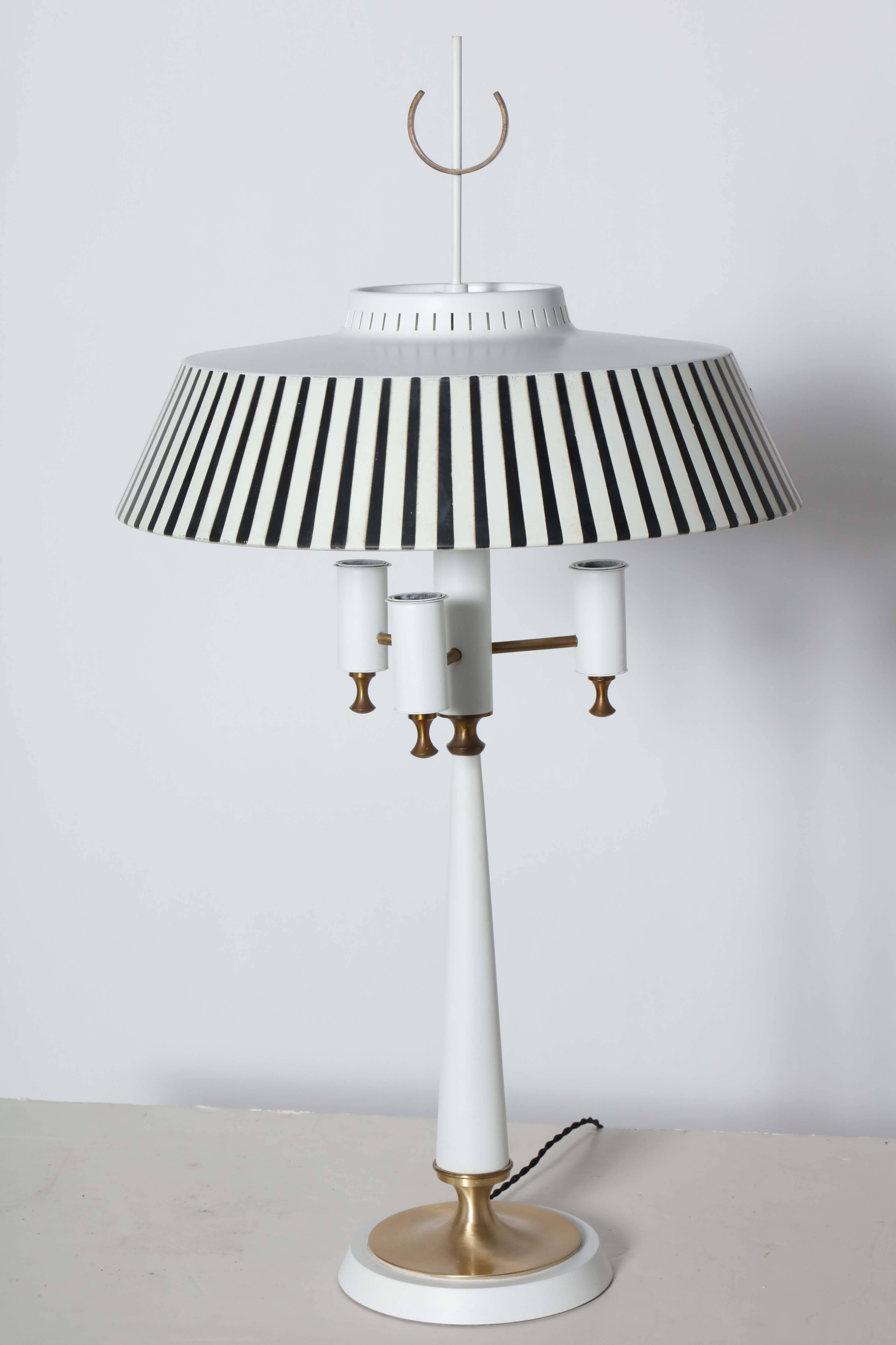 Gerald Thurston for Lightolier White Table Lamp with Striped Shade, 1950's.  Featuring a White stem, three Brass arms, triple White enameled candlestick sockets, stenciled Black and White striped painted metal shade, White perforated top, circular