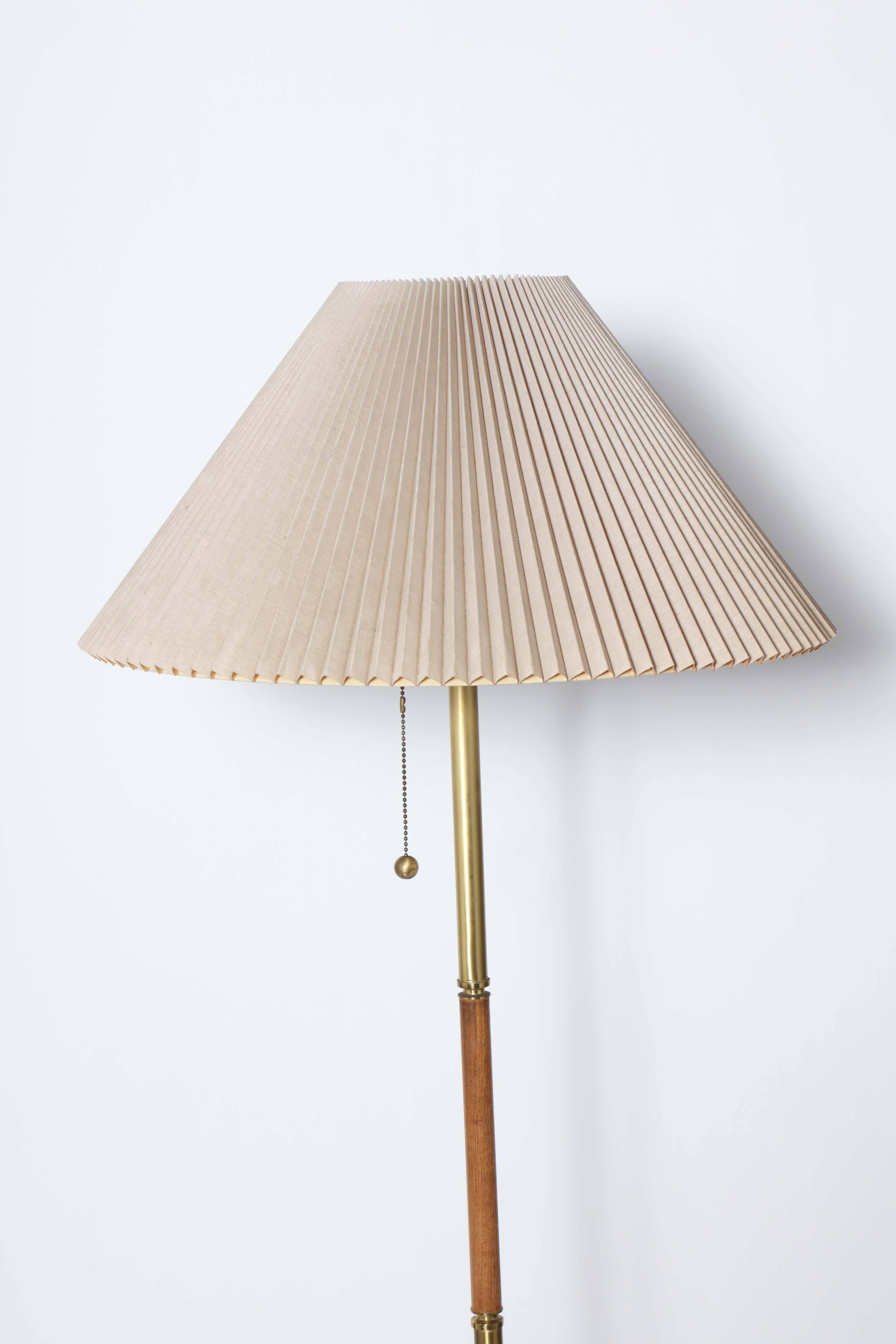 American Mid Century Gerald Thurston for Lightolier Brass, Teak and Marble Reading Floor Lamp. Featuring a Brass stem, Teak handle and round White Carrara Marble base. Three sockets. Shown with Taupe pleated accordion Shade for size only  (13.5H x