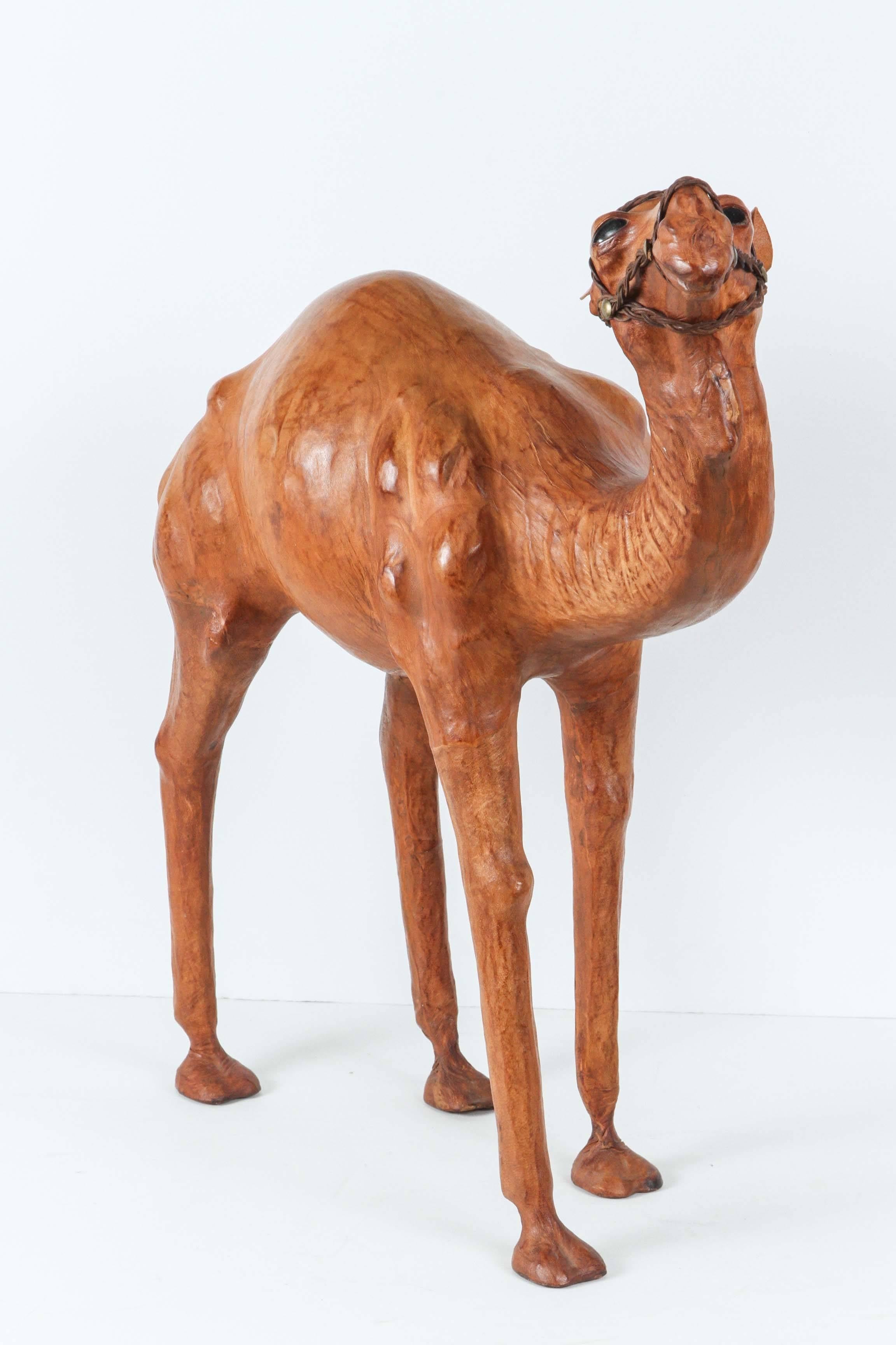 Leather wrapped Moroccan camel sculpture. Camel color leather, nicely done.
Handcrafted in Marrakech, Morocco