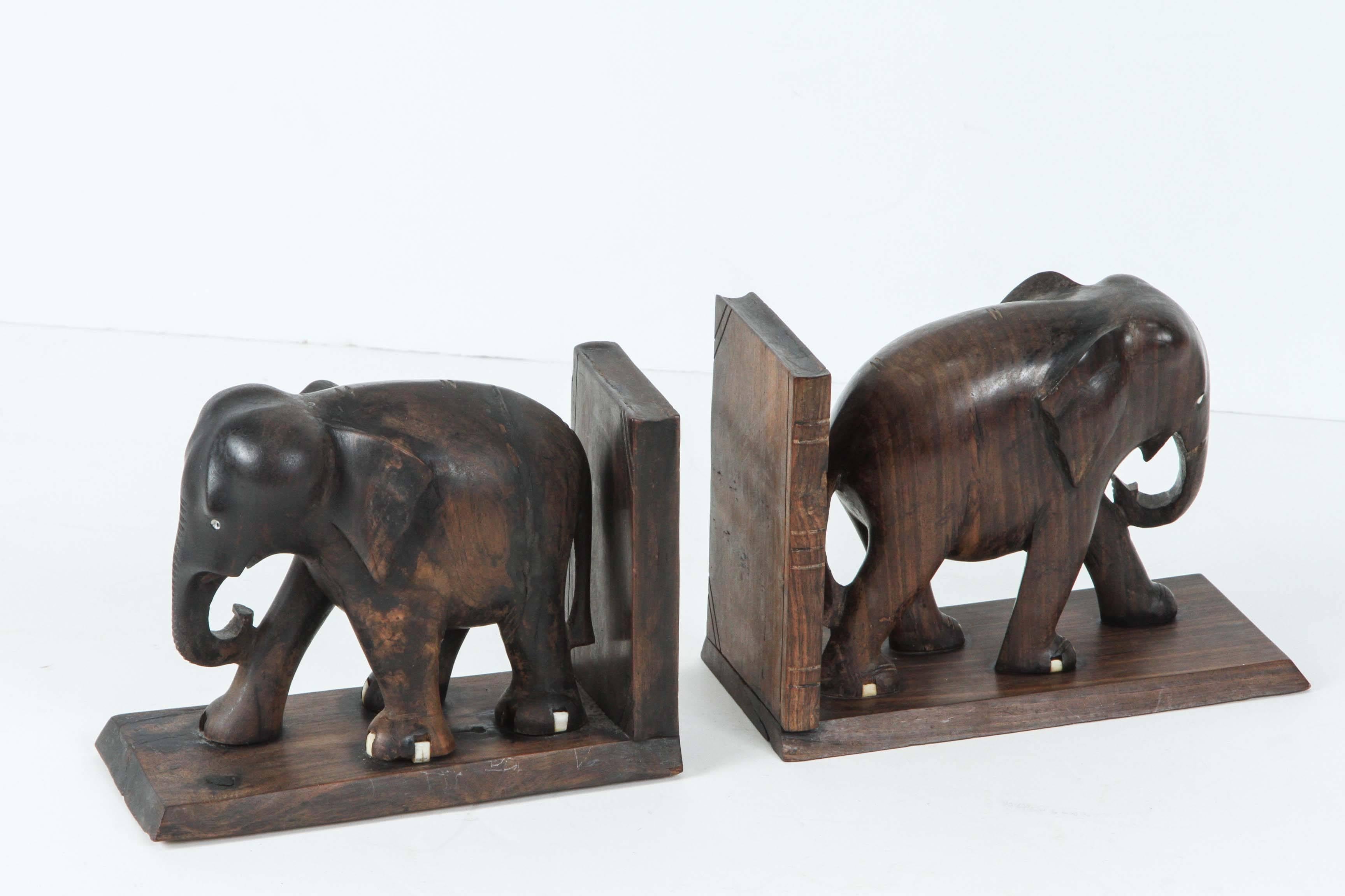 Nice pair of hand-carved ebony elephant bookends.
Bone accent in eyes and feet, no tusks.