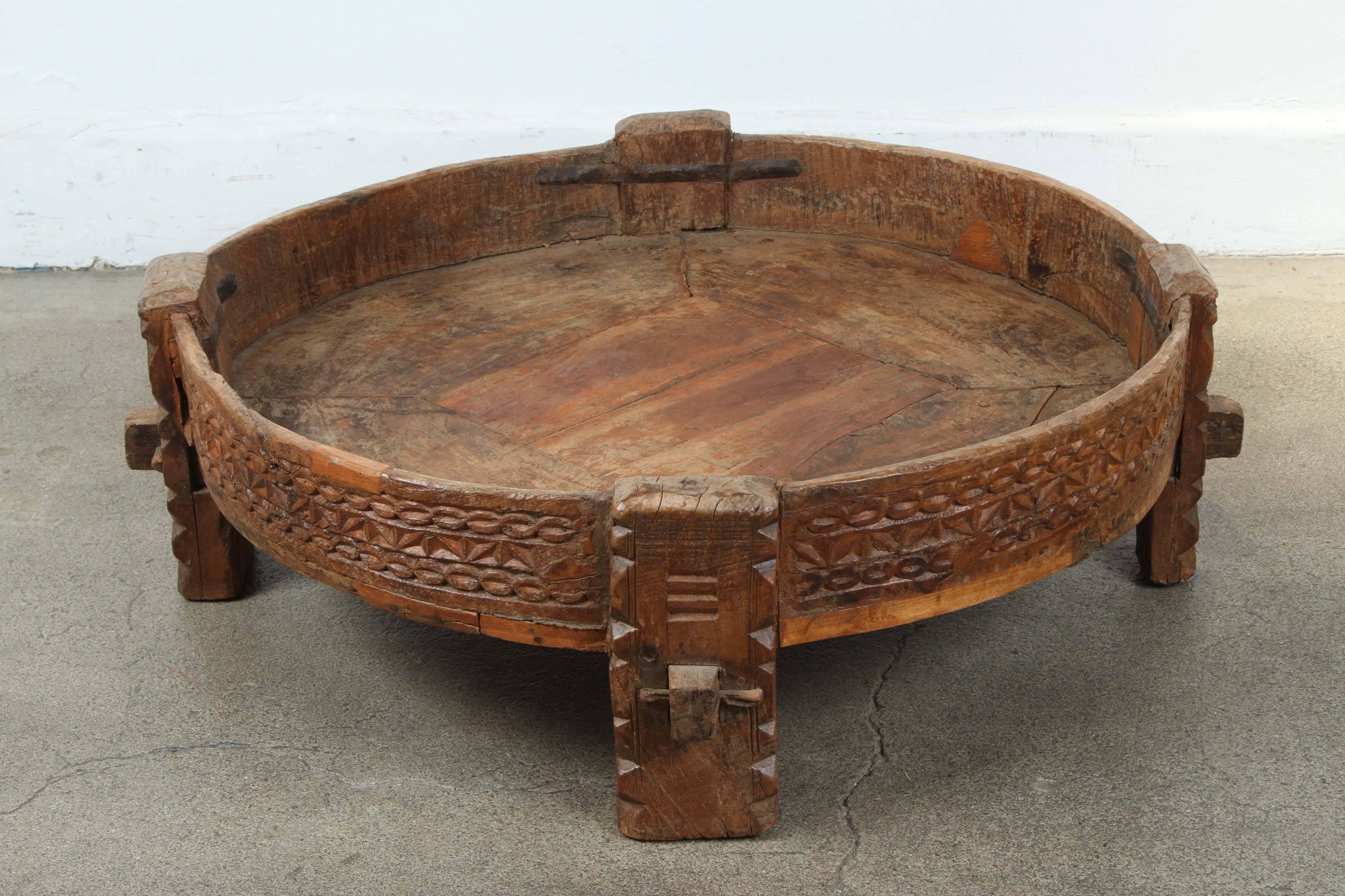 Great Moroccan round tribal table, made of wood and iron, hand-carved with geometric African design.
Handcrafted in North Africa by the Berber Tribes of Morocco.
Great to use indoor or outdoor. 
Great patina.