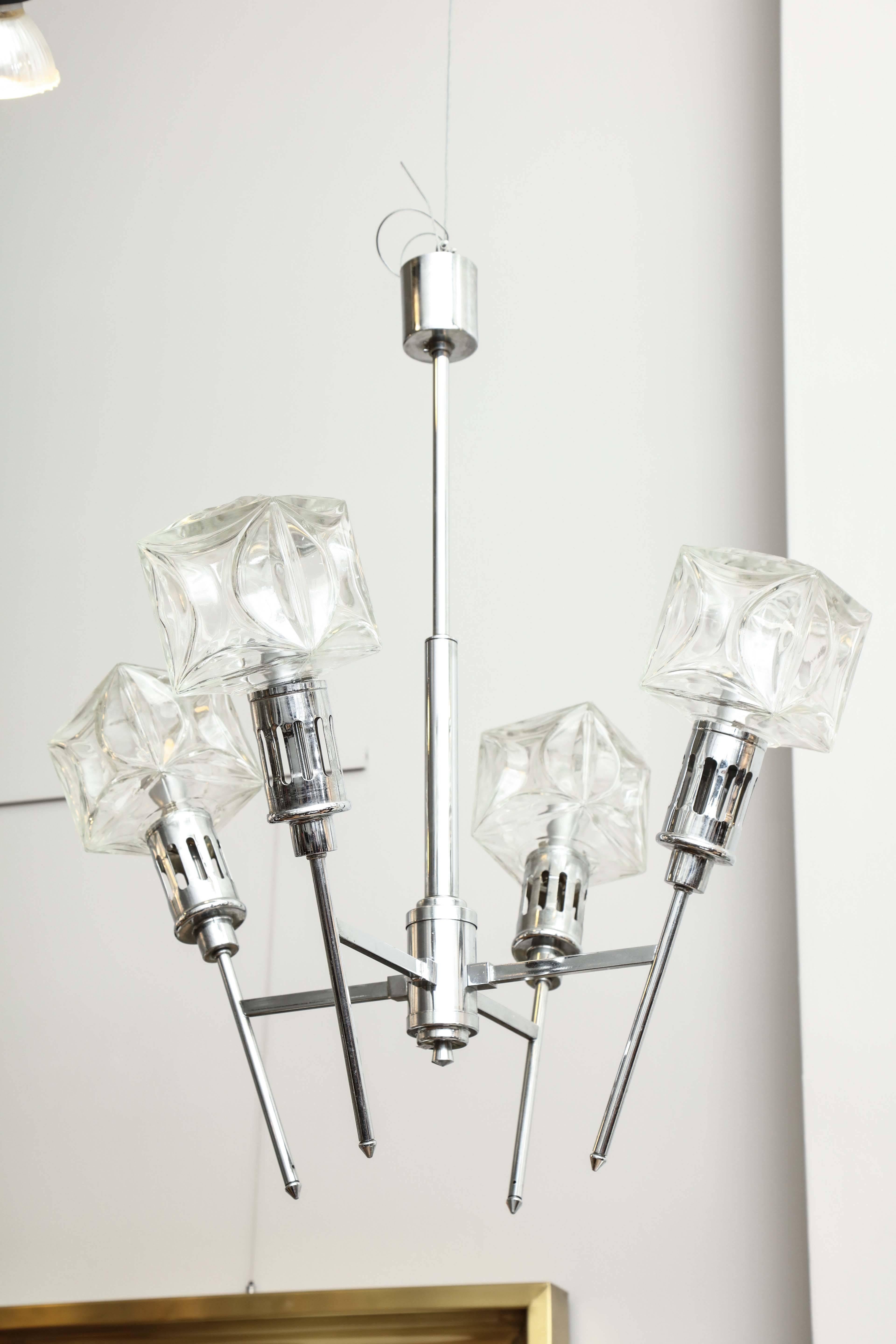 Mid-Century Modern chandelier in chrome with four glass square globes.