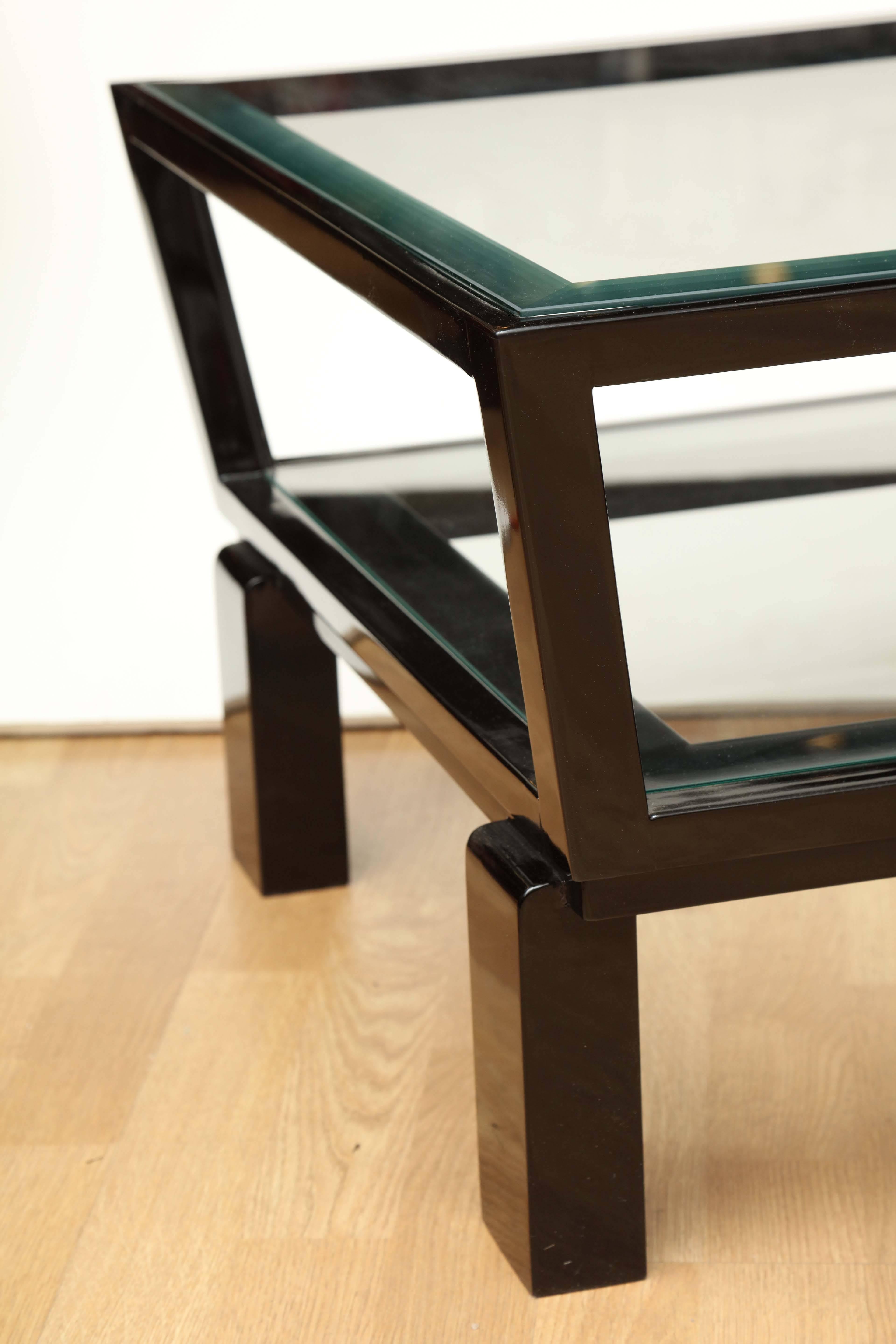 Chic Bauhaus cocktail tables. Black lacquer and glass. 
Pair available, priced and sold individually.