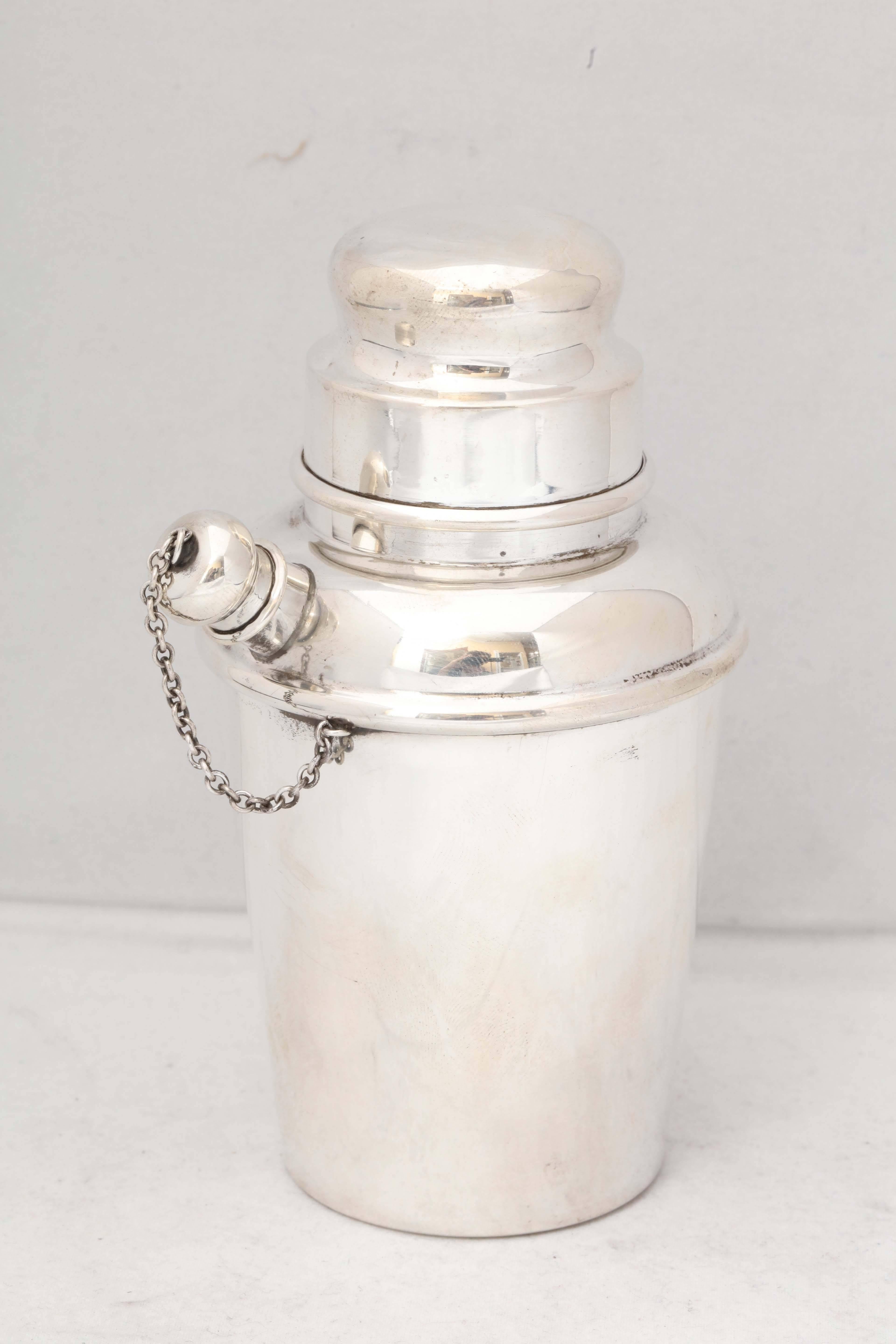 Art Deco style, sterling silver cocktail shaker, Reed & Barton Co., Taunton, Mass., year marked for 1949. Measures: 6