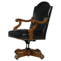 Fauteuil pivotant américain de style victorien du XIXe siècle, en chêne et cuir noir