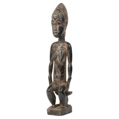 Escultura de un «esposo espiritual» de los baulé, madera tallada, Costa de Marfil, siglo XX