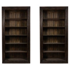 Dark Brown Wooden Bookcases with Carved Trim and Glass Shelves