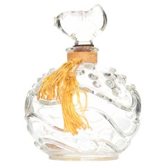 Flacon de parfum en verre Art déco de la marque Theon Company, États-Unis – Motif en relief