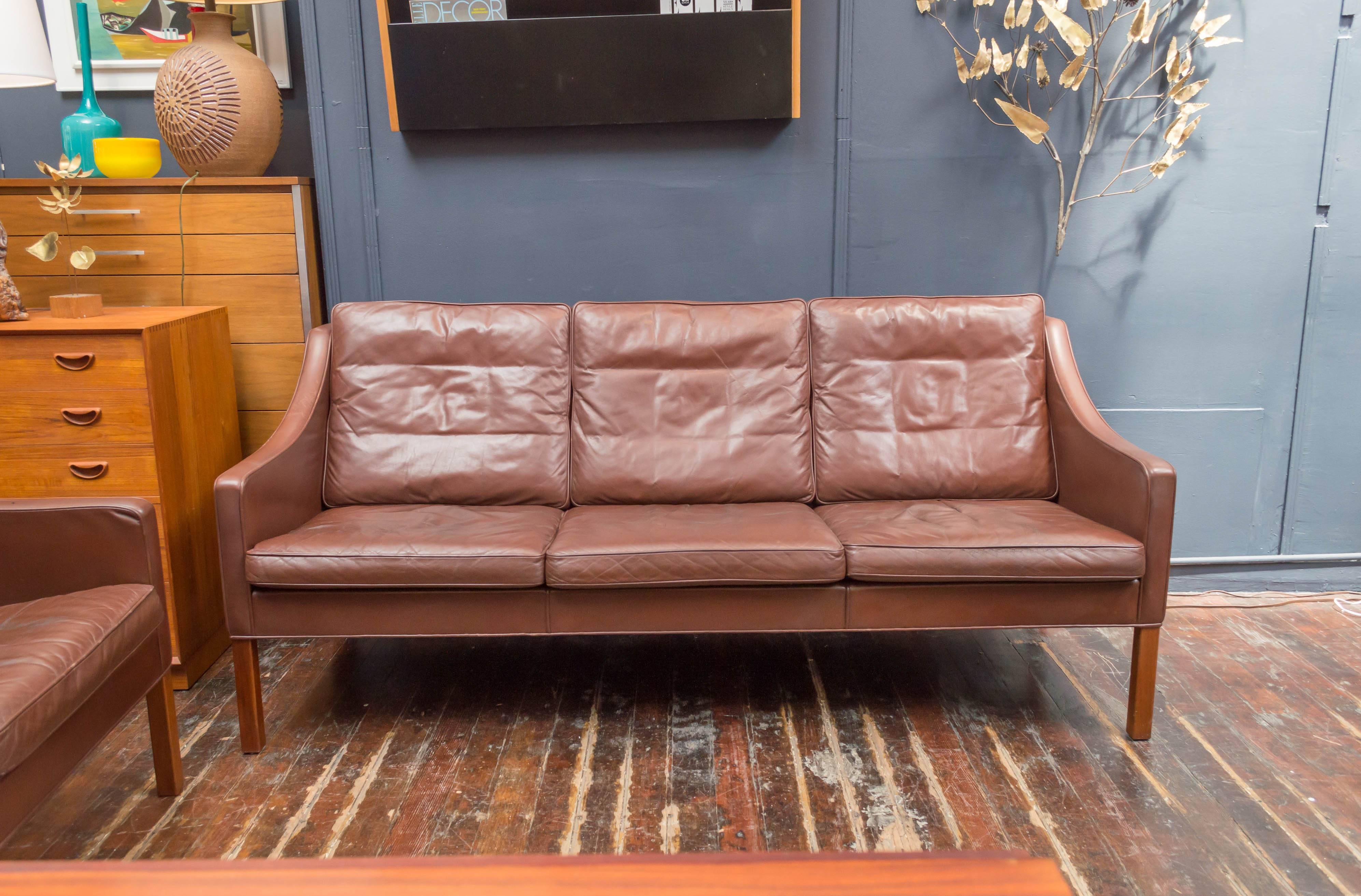 Børge Mogensen design cognac leather sofa for Fredericka, Denmark. Purchased from the original owners in good vintage condition with age appropriate wear and tear. 
Matching armchairs are available sold separately.