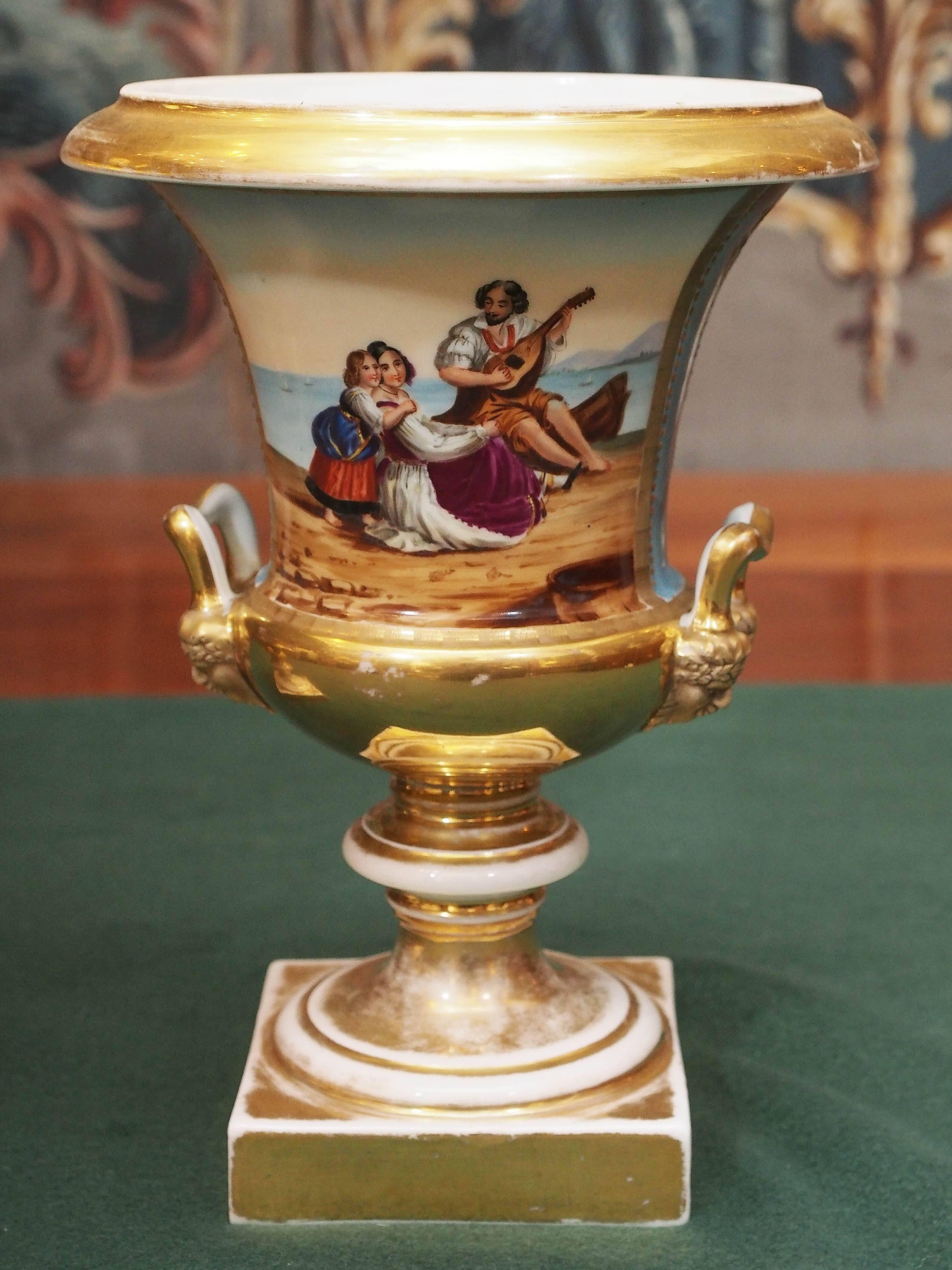 Pair of Vieux Paris Campagna form urns with allegorical scene on one side and floral decoration on the other. Background color is blue de celeste.
 