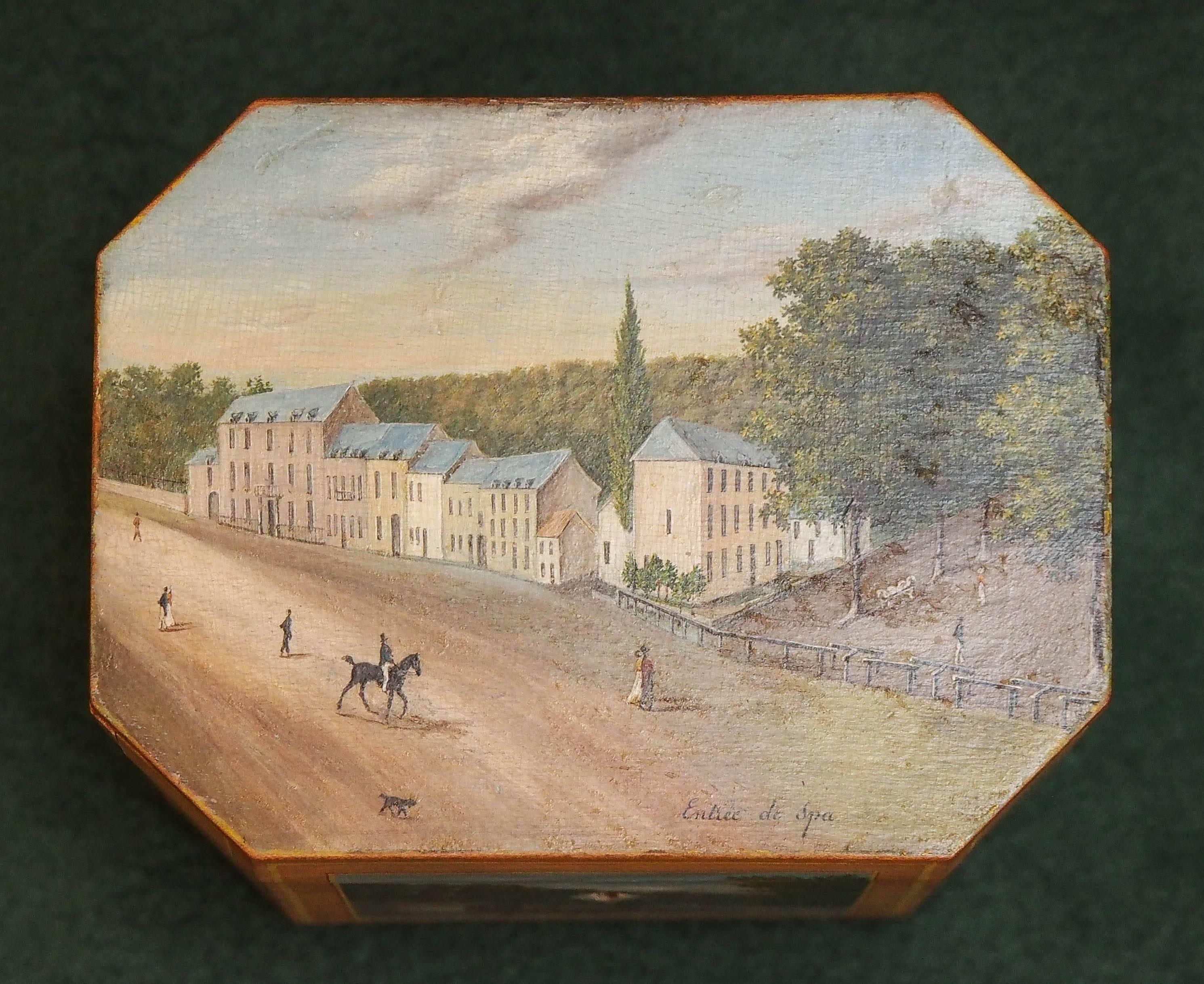 French painted tea box withe scenes of chateau life. Main photo on lid says 