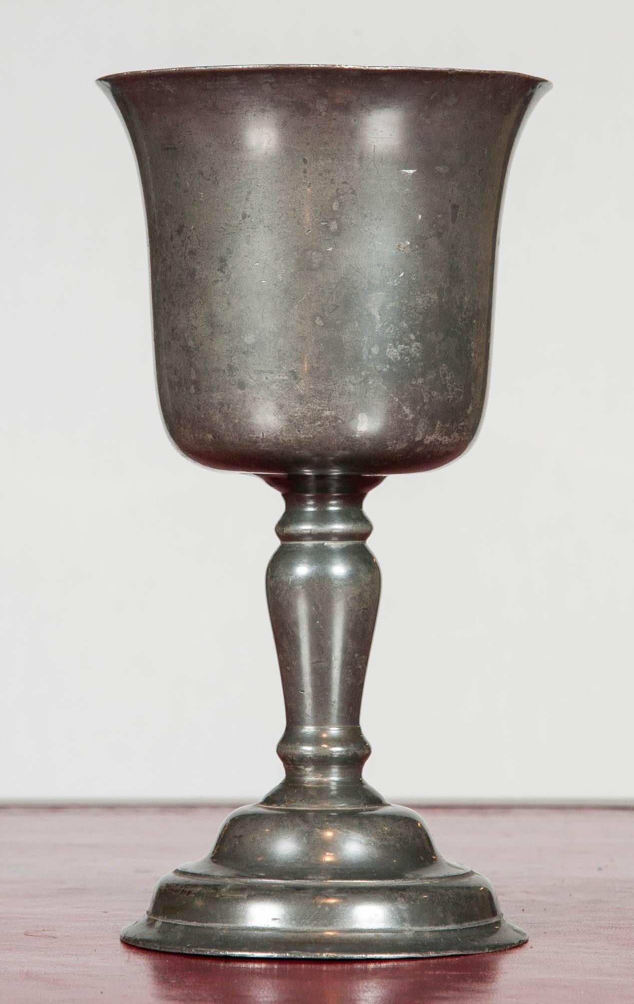 An unusual matched pair of pewter chalice shaped wine vessels; the stem of one is inverted. Game of Thrones Elizabethan style!

 