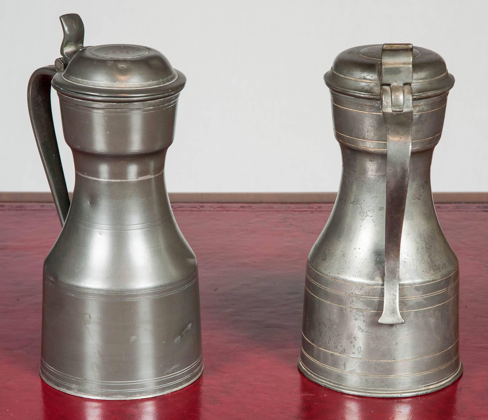 A fabulous matched pair of pewter flagons, Scottish Tappit-hen style.

 