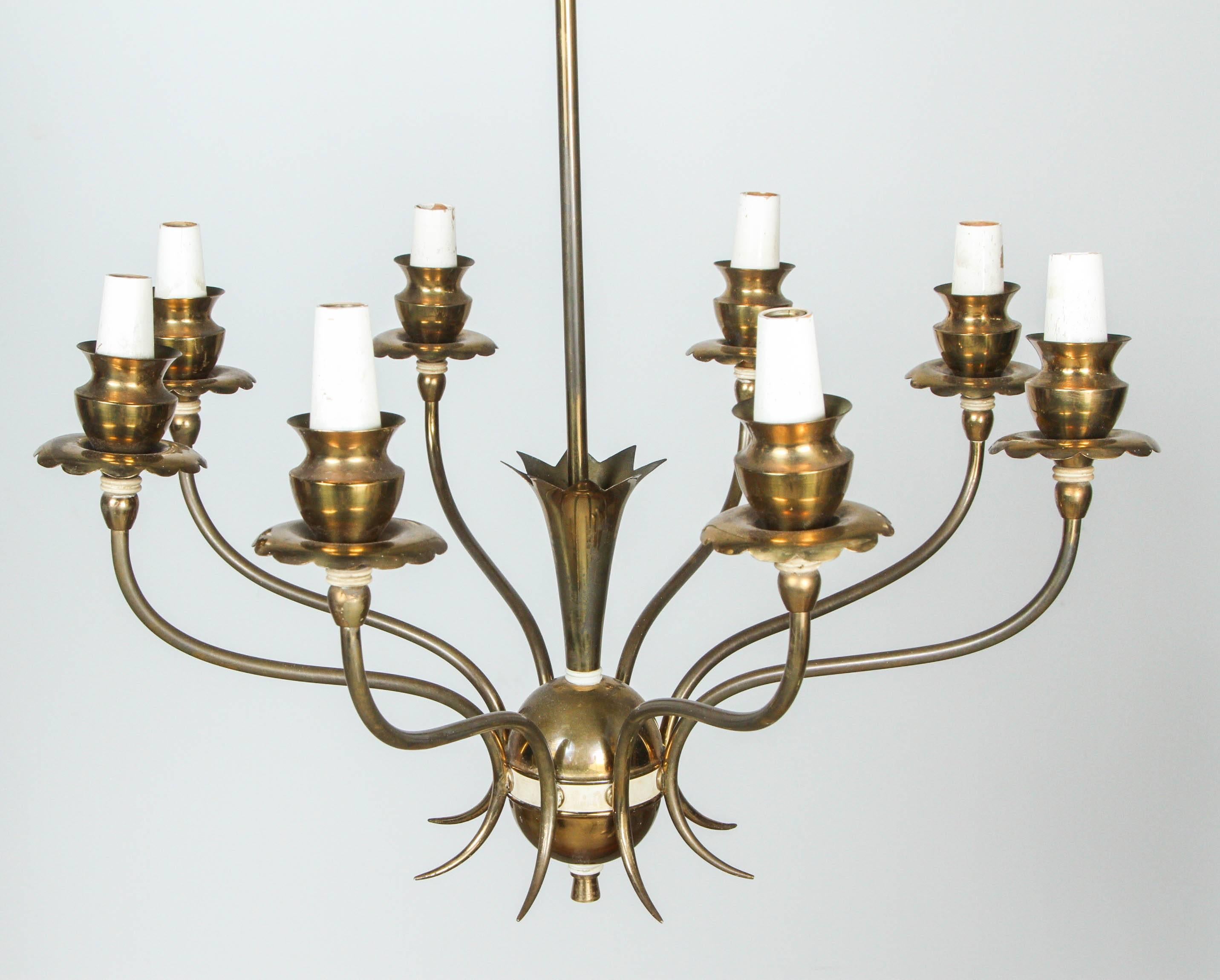 Italian brass chandelier with eight arms and flower details.