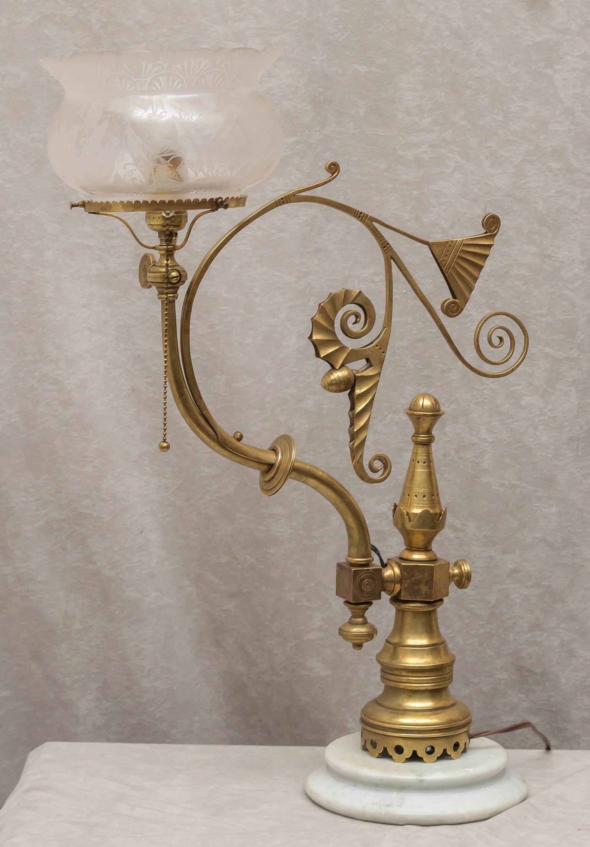 This stunning newell post lamp features all the beautiful work done in the 1880s. It has an original deep etched gas shade and has been converted to electricity. It has been mounted on a marble base for stability; you may remove the marble and mount