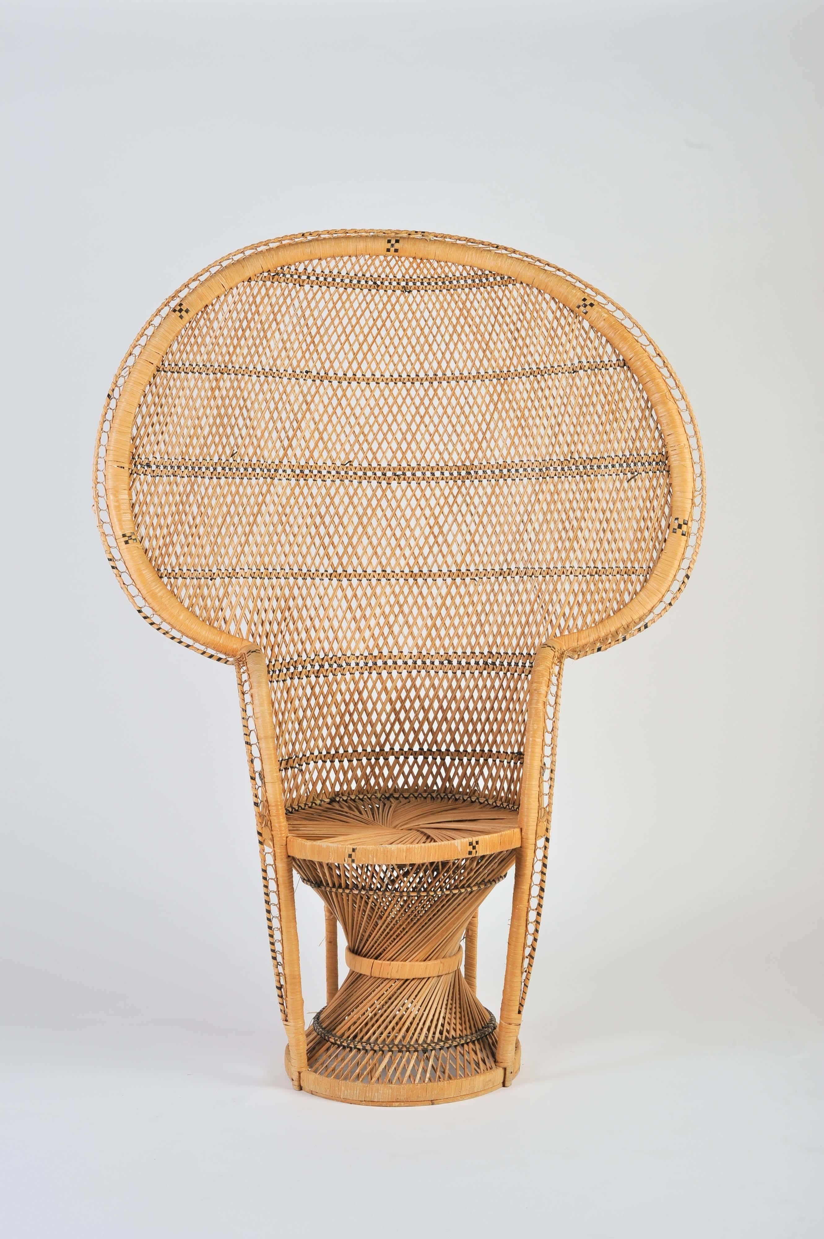 A large vintage Bohemian high-quality wicker Emmanuel/Peacock chair.
The Emmanuel/Peacock chair made famous in the1974 by the actress Sylvia Kristel on the move 'Emmanuel'. Sylvia Kristel was sitting half naked in one of those wicker peacock chairs.