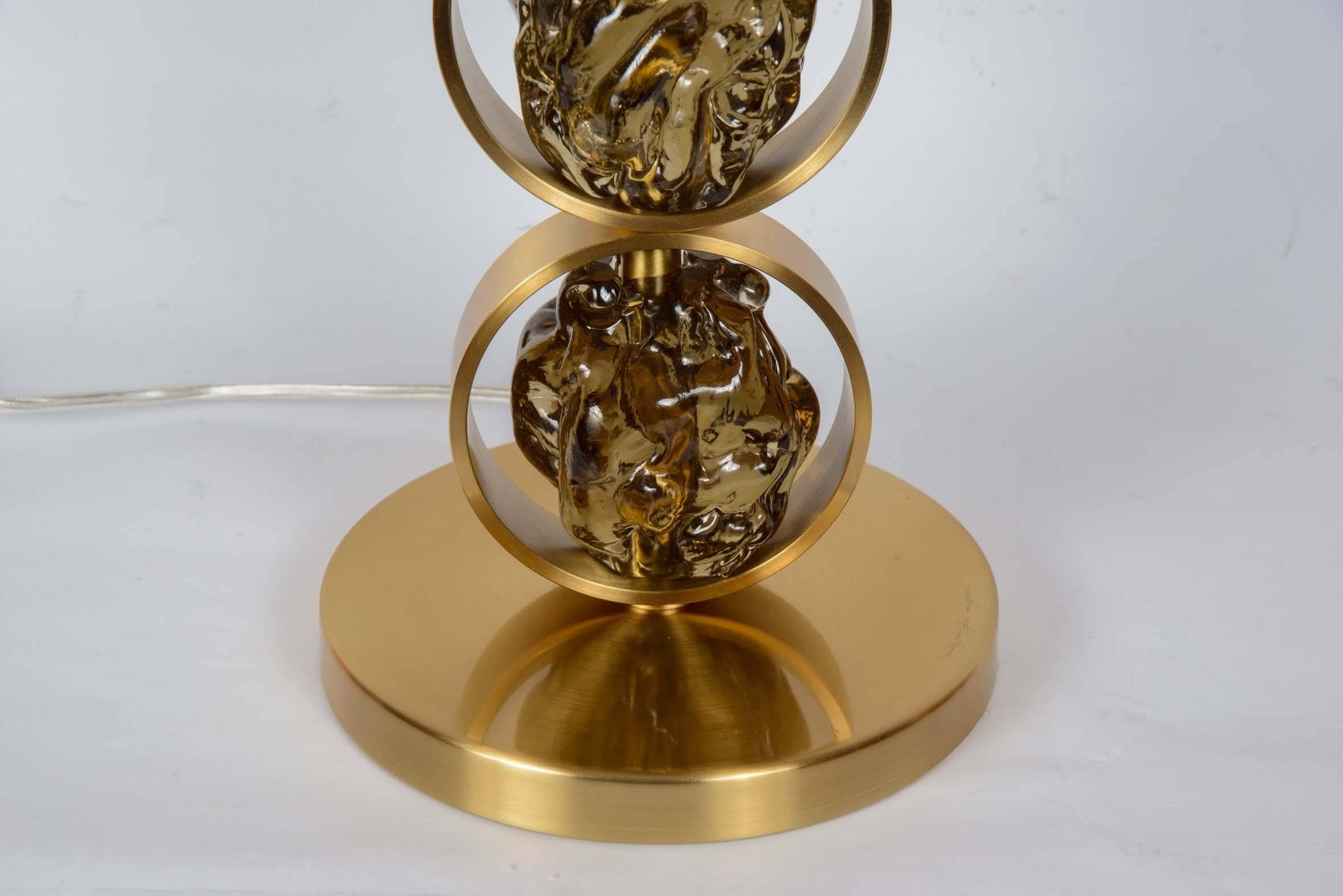 Awesome pair of table lamps in satined brass and Murano glass.
Dimensions given without shade.
No shade provided.
Signed.