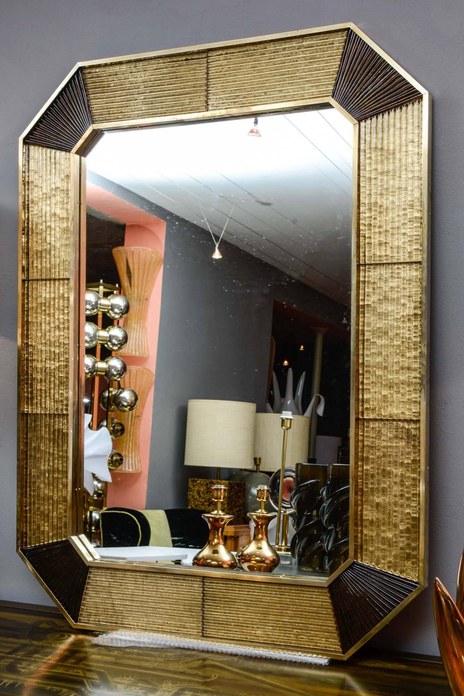 Unusual Murano glass mirror with brass frame.
Possibility of a second one.
Price for one.