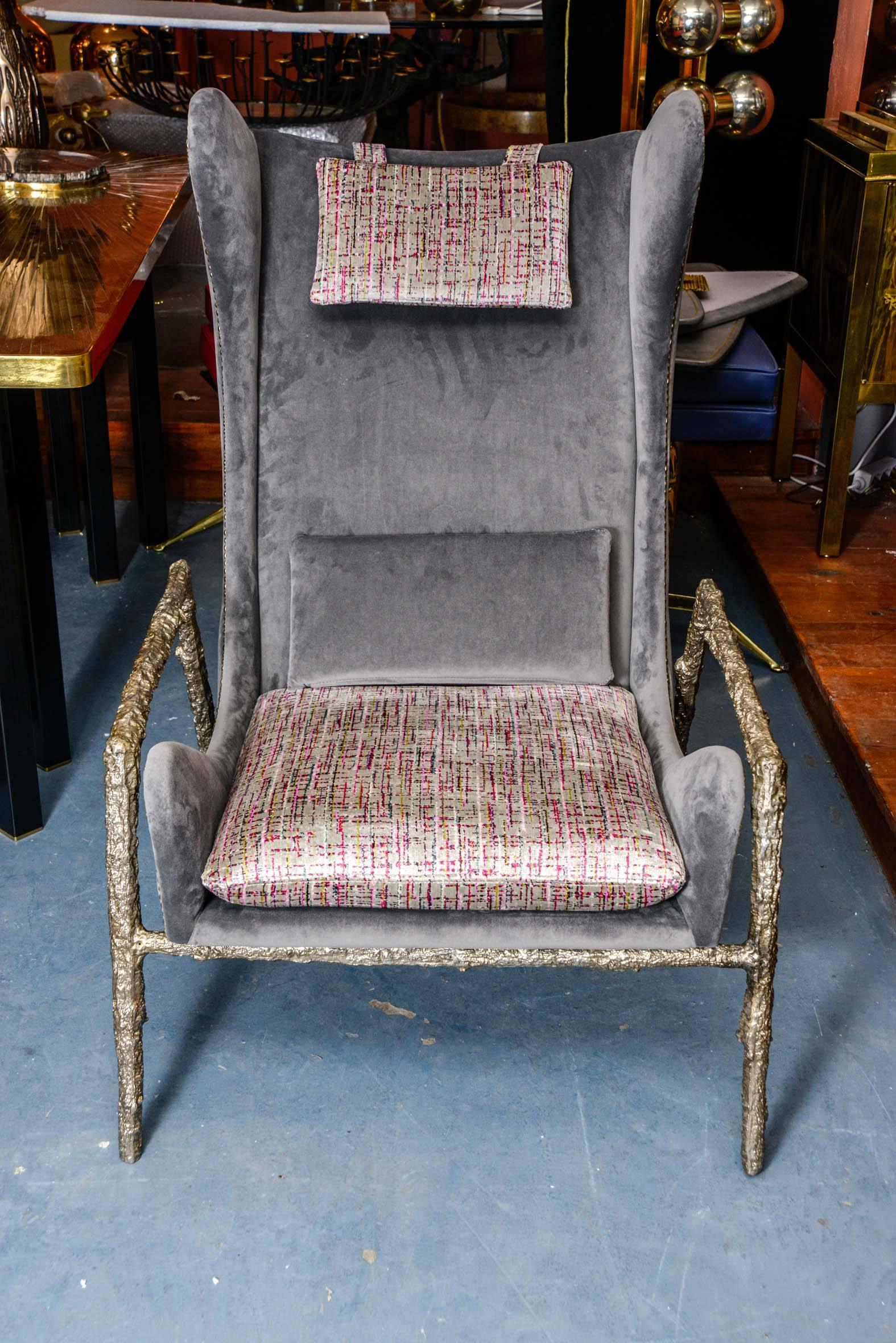 Pair of Italian style armchairs with solid bronze feet.
