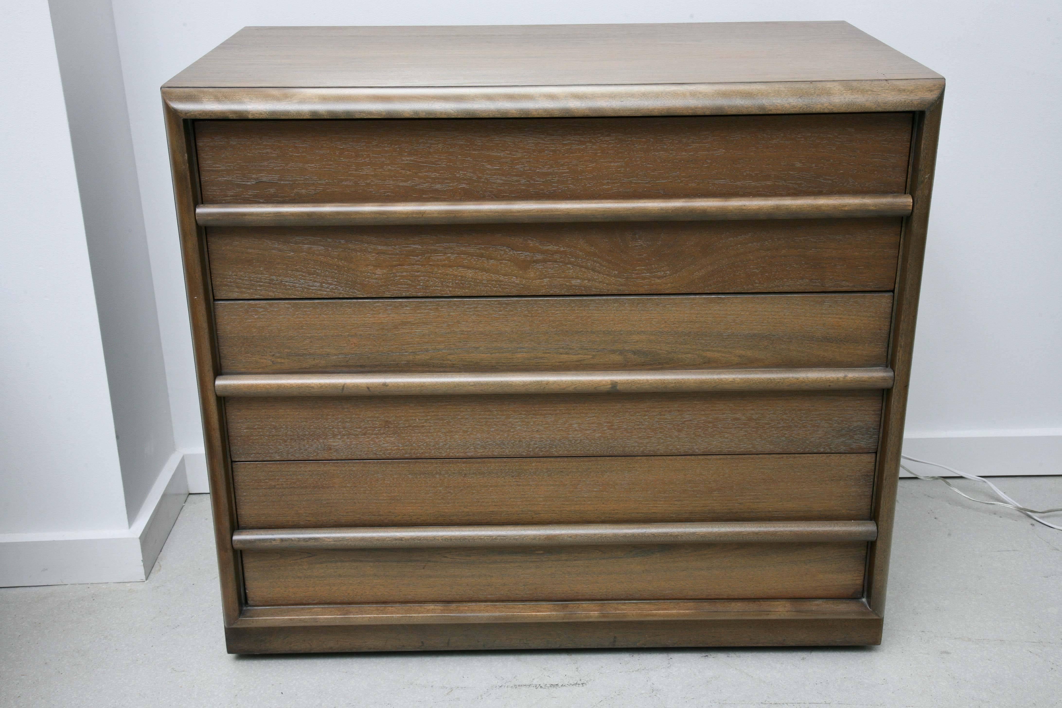 Pair of Mid-Century Modern chests in limed finish. Each chest has three drawers with slim handle integrated into the design.