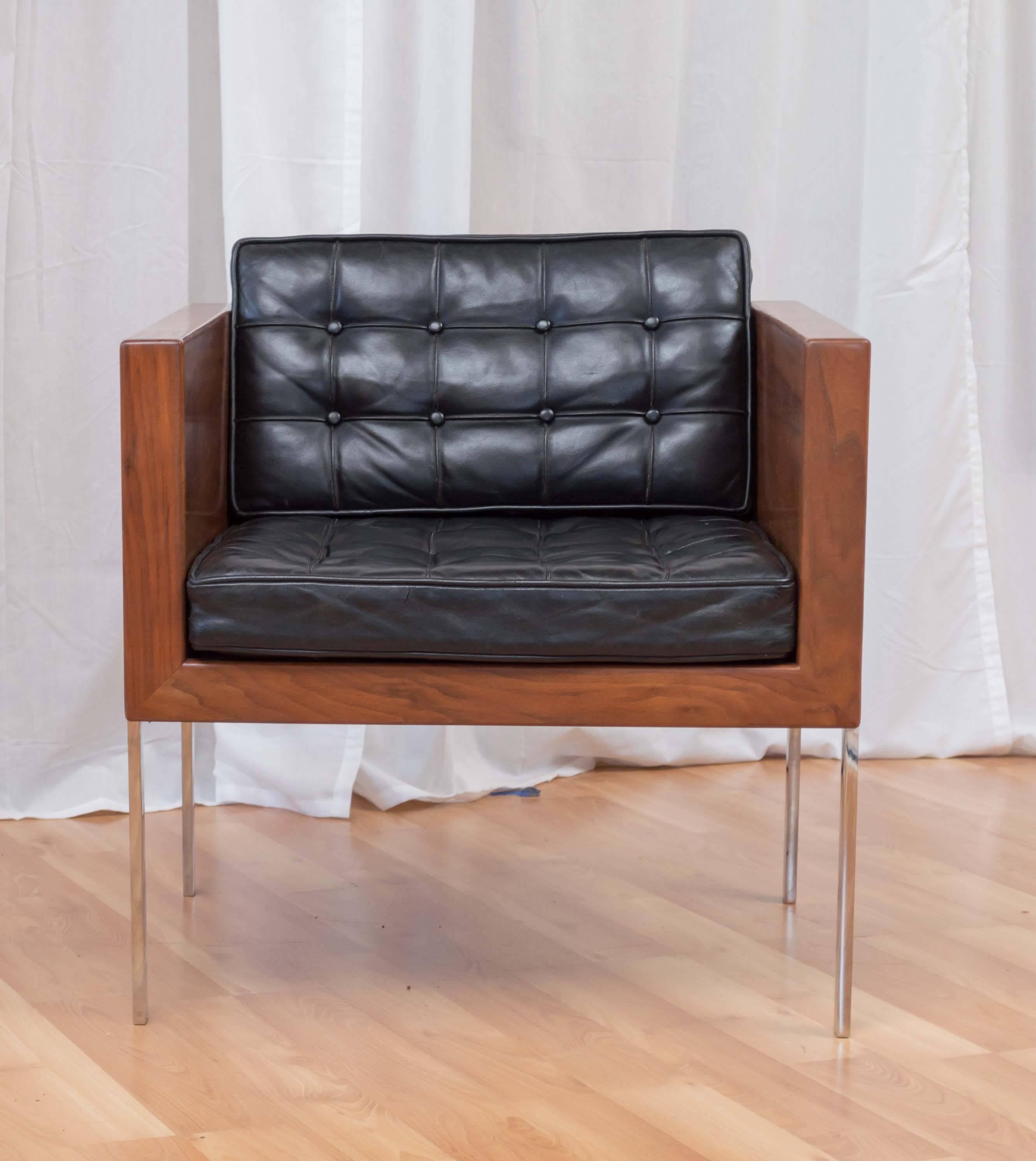 A walnut, leather, and polished stainless steel “Architectural Series - Model 248” cube chair by Harvey Probber.

This fantastic and deceptively comfortable chair has a wraparound walnut frame that’s been professionally refinished, and features