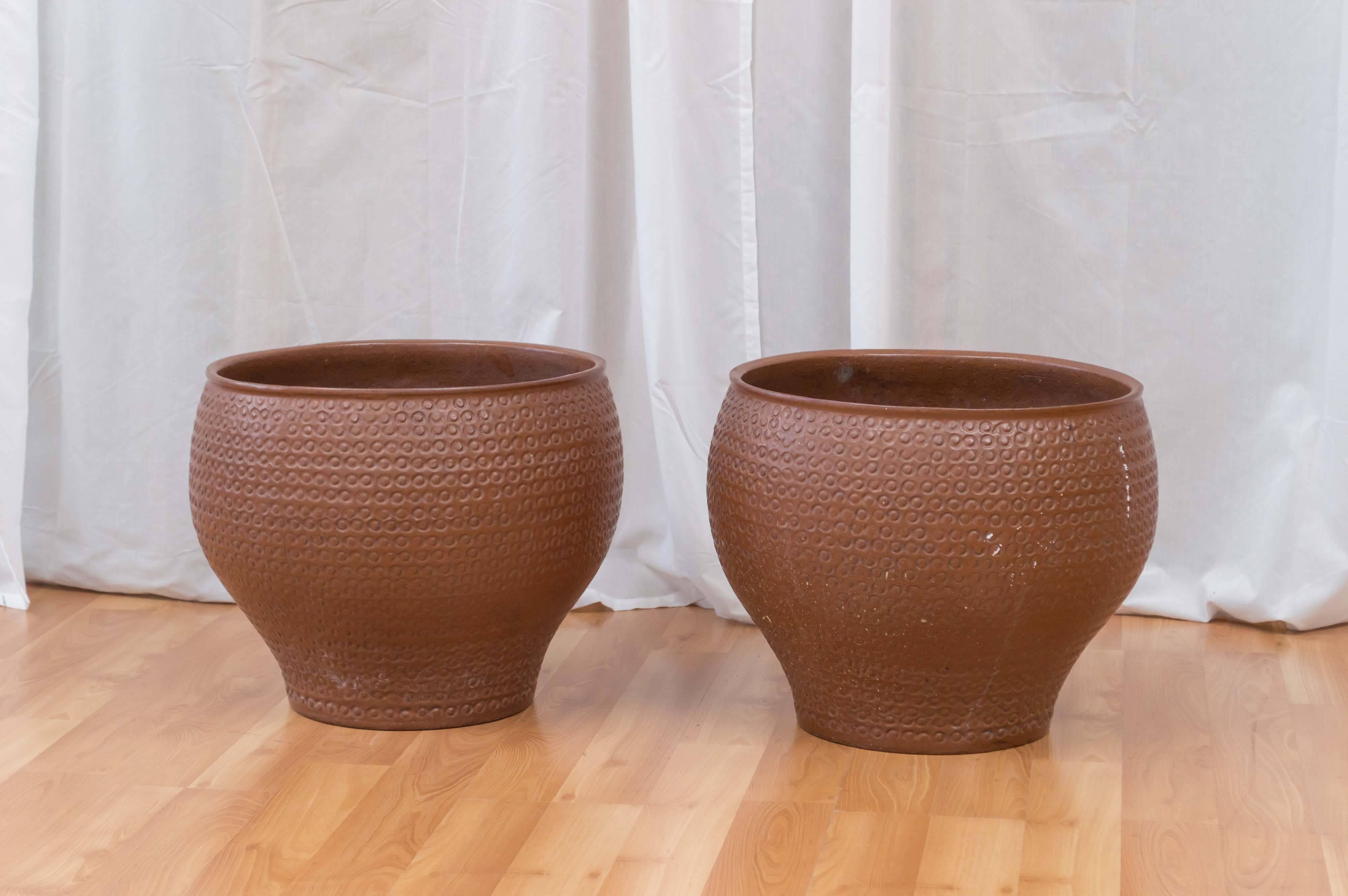 Pair of planters circa 1960s by David Cressey for Architectural Pottery. This design is known by dealers and collectors as Cheerio. Company was based out of Los Angeles California. They are Classic California Modern.