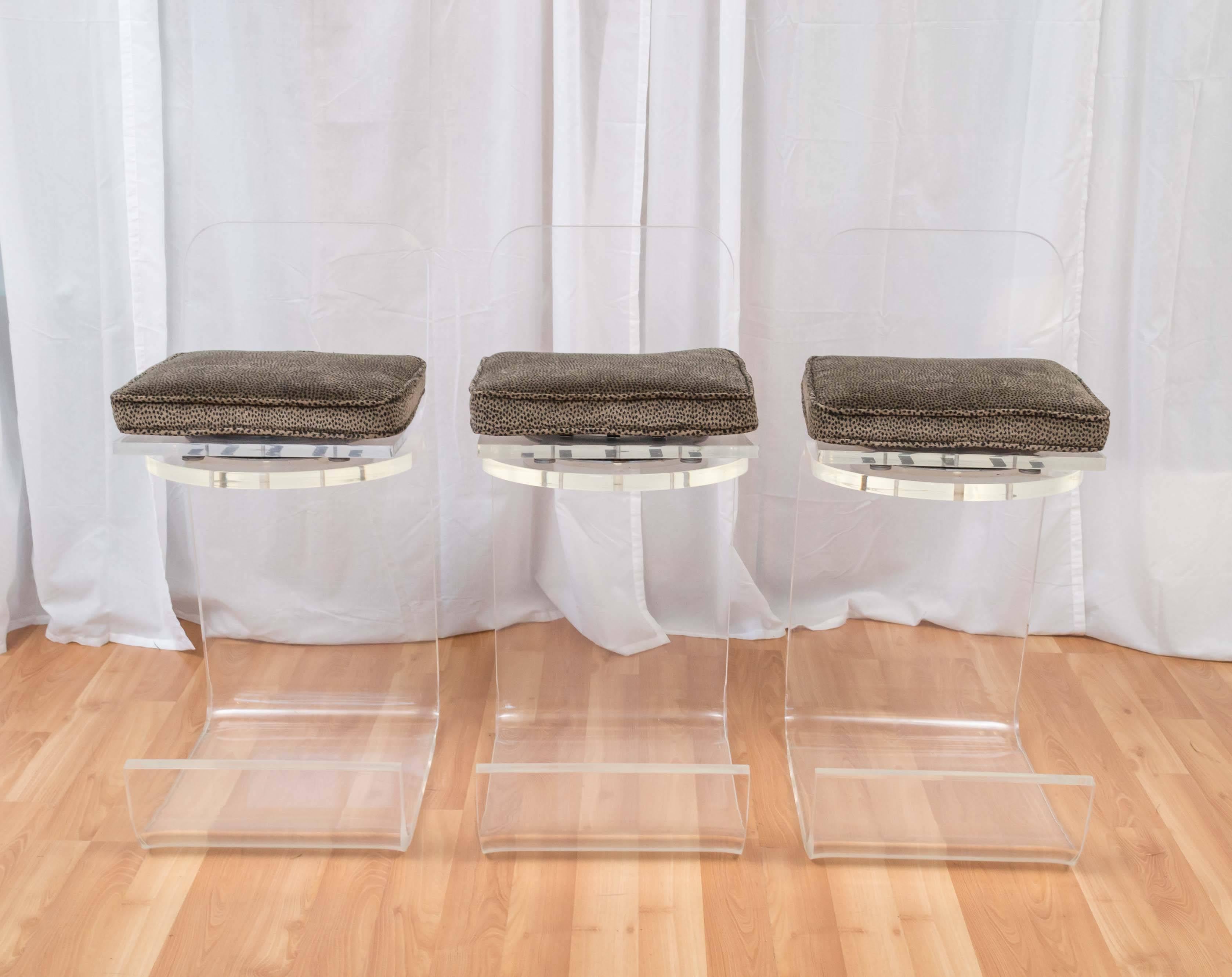 A very uncommon three-piece set of Paul M. Jones-style Lucite counter-height bar stools in uncommonly great condition.

Sleek, fabulous and deceptively simple, they’re a clear example of economy of design and mastery of materials at their finest.