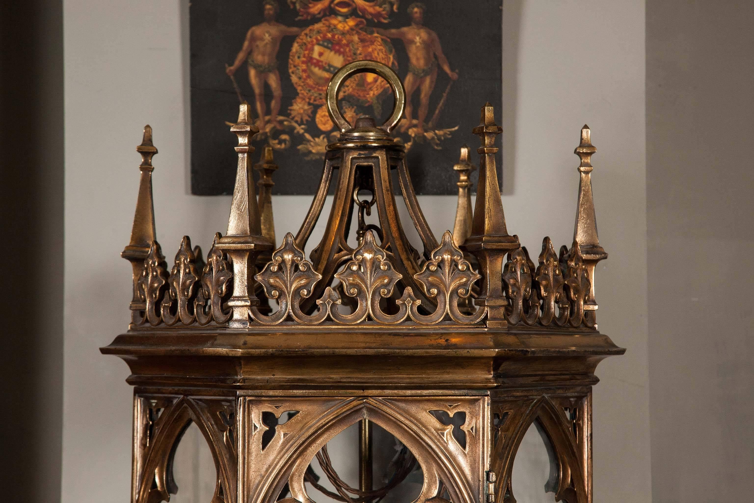 A highly important pair of lacquer gilt bronze Gothic Revival lanterns.