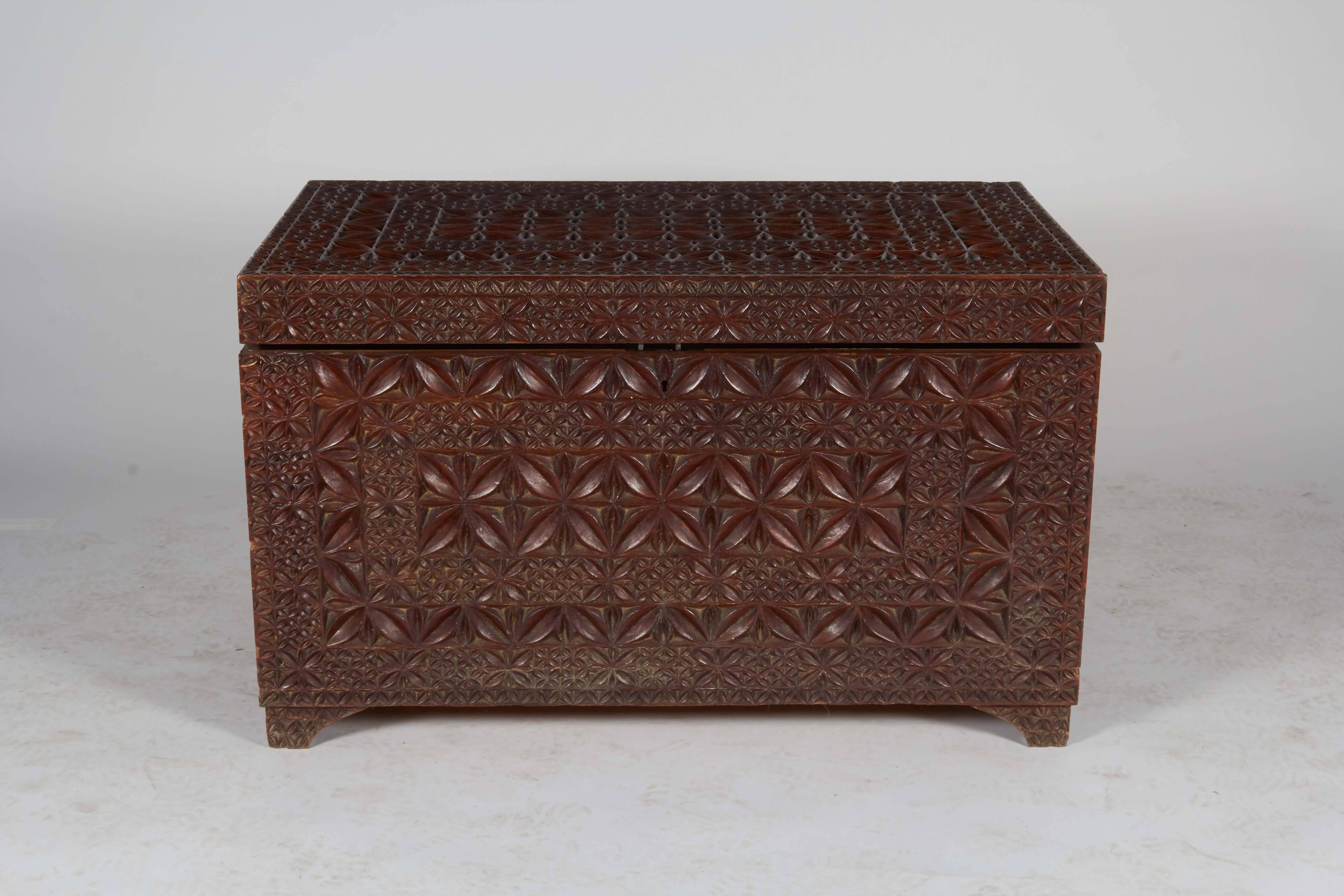 Ornate carved wood trunk, 
Key is not included.
Measures: 25 inches x 22 inches x 48 inches.

 Not available for sale or to ship in the state of California.