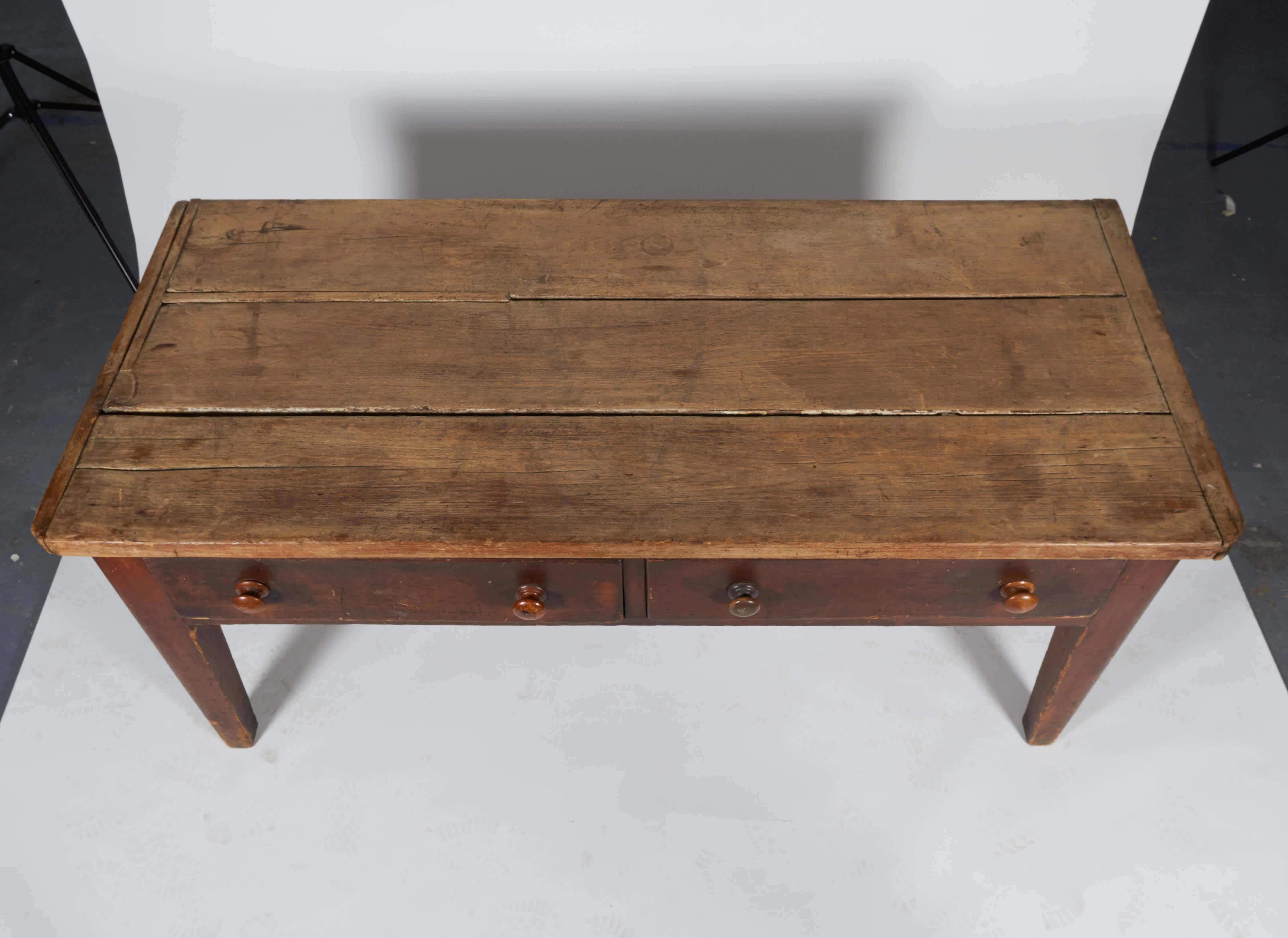 Distressed wood table with two drawers. 

Not available for sale or to ship in the state of California.