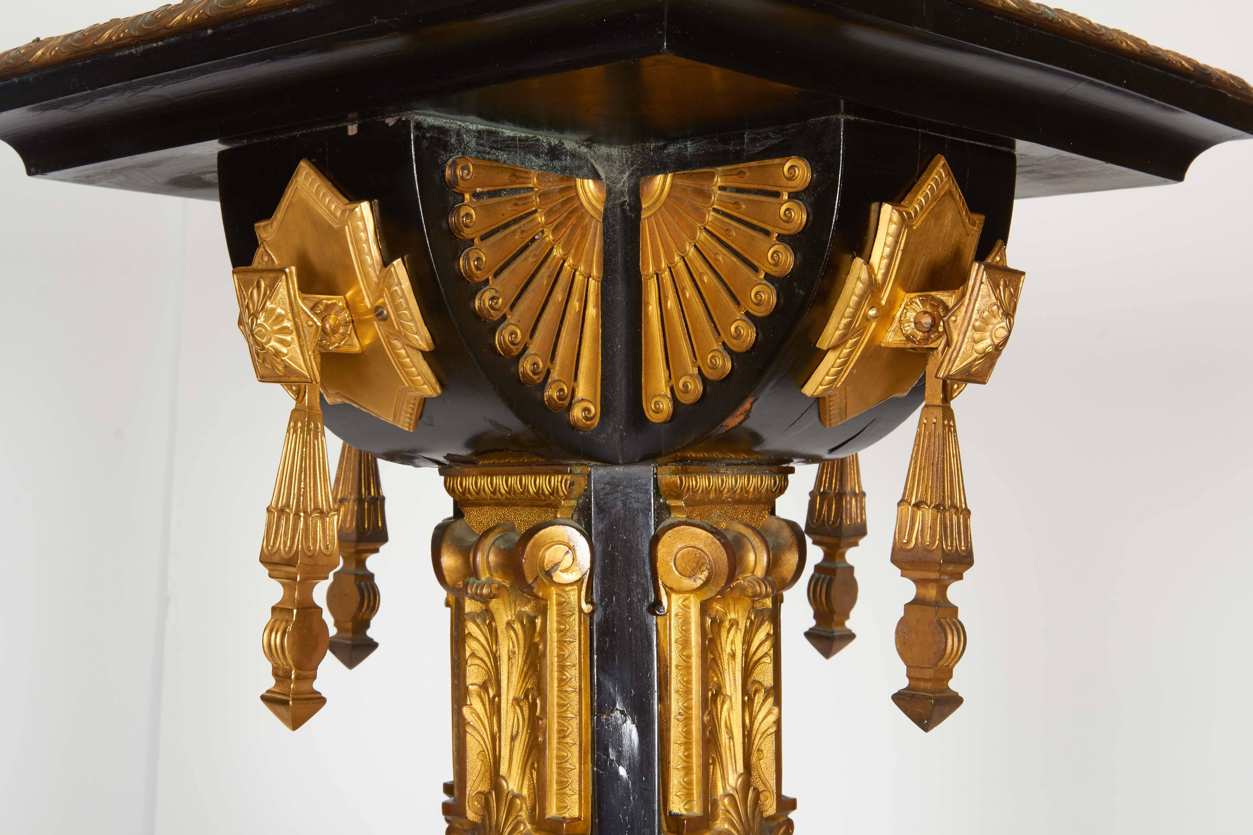 A highly important pair of Neo Grec ormolu and porcelain mounted ebony torchieres/pedestals.

By Charles Guillame Diehl, The design attributed to Jean Brandley, Paris, circa 1870.

Specializing in Neo-Grec decorations and furnishings, Charles
