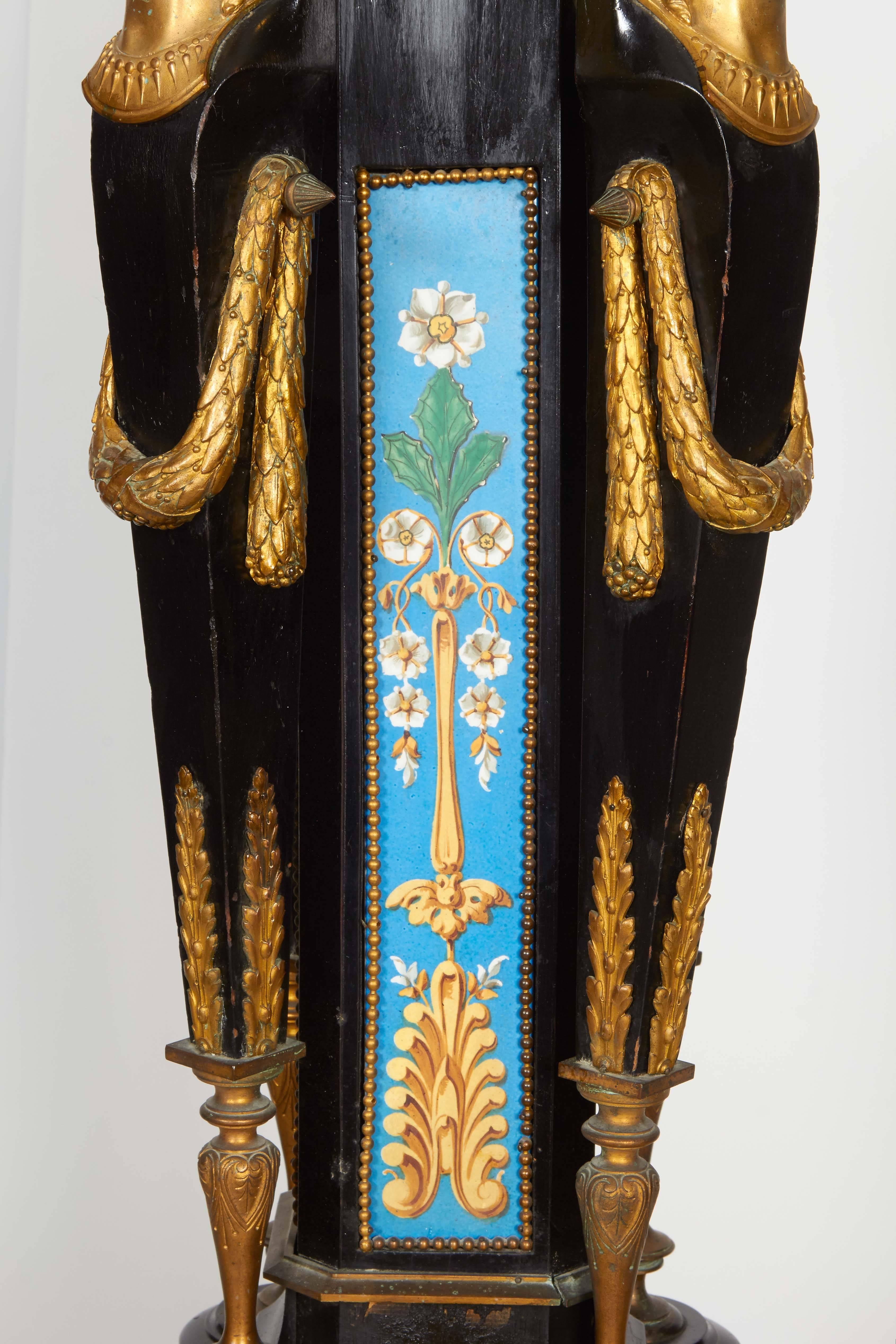 French Highly Important Pair of Neo Grec Ormolu and Porcelain Mounted Ebony Torchieres