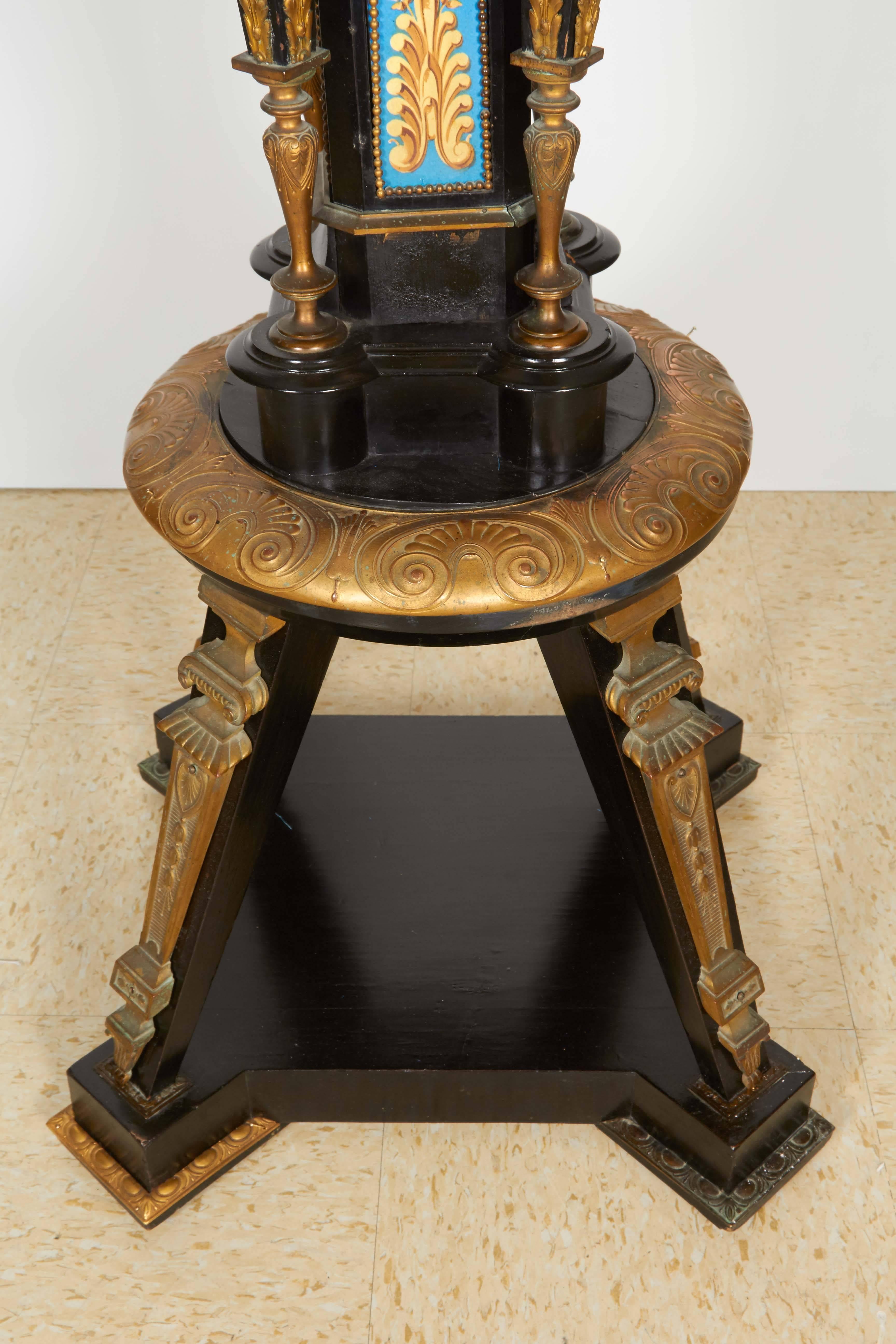 Highly Important Pair of Neo Grec Ormolu and Porcelain Mounted Ebony Torchieres In Excellent Condition In New York, NY